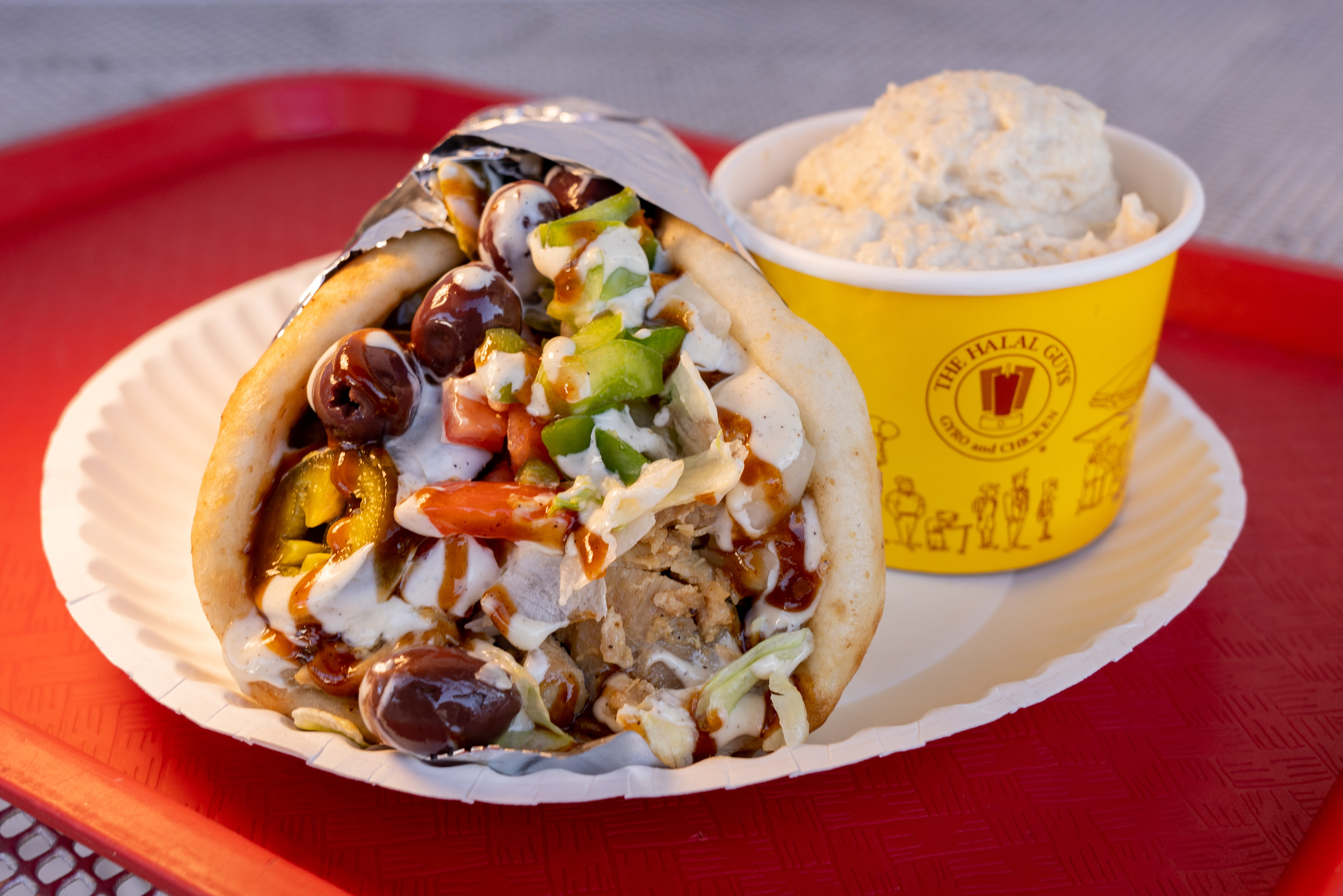 A gyro wrap and hummus from Halal Guys in Tempe on Nov. 16, 2020. (Photo by Samantha Chow/PHOENIX Magazine)