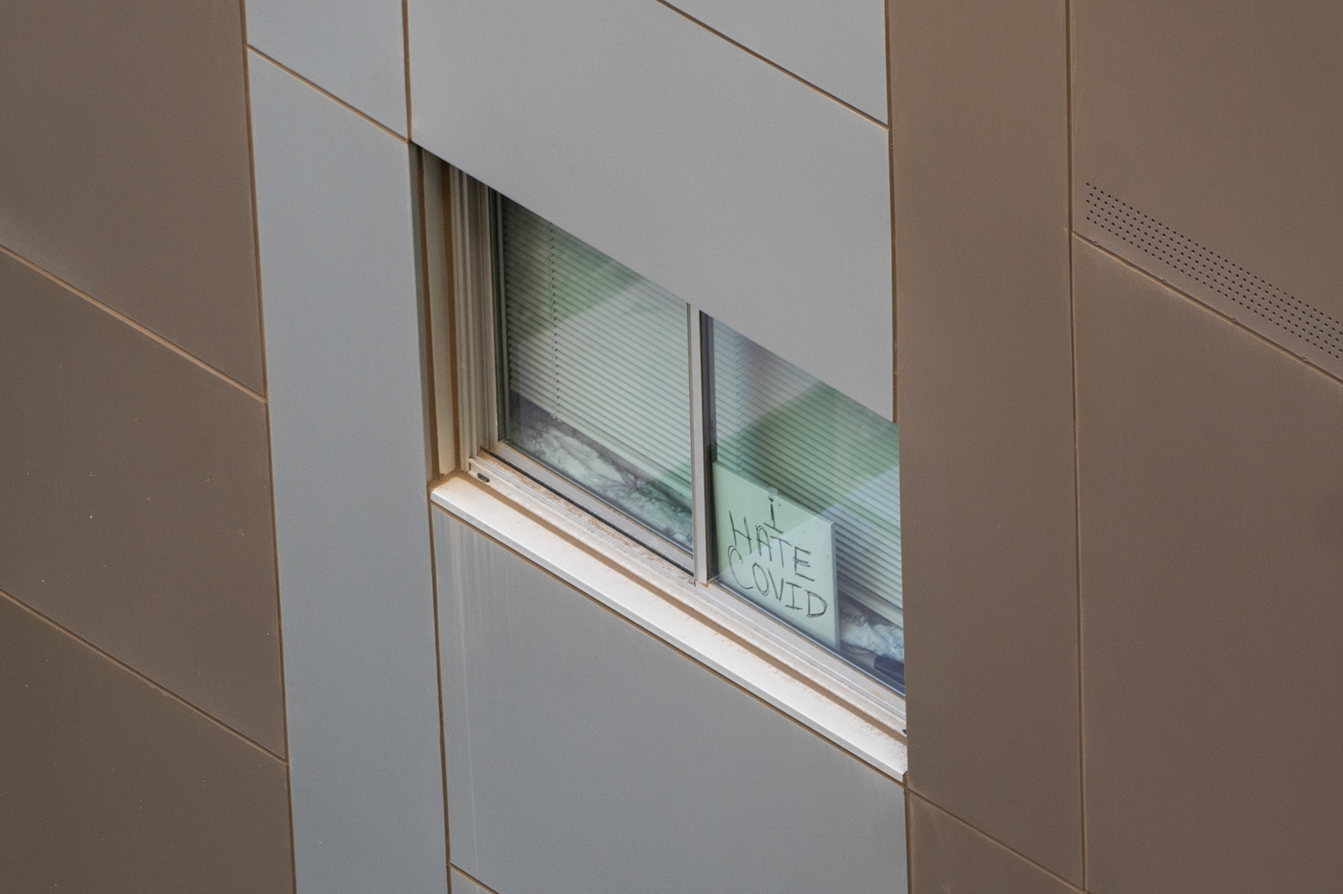 A sign in a fourth-floor resident's dorm window at Taylor Place on Sept. 17, 2020. (Samantha Chow/State Press)