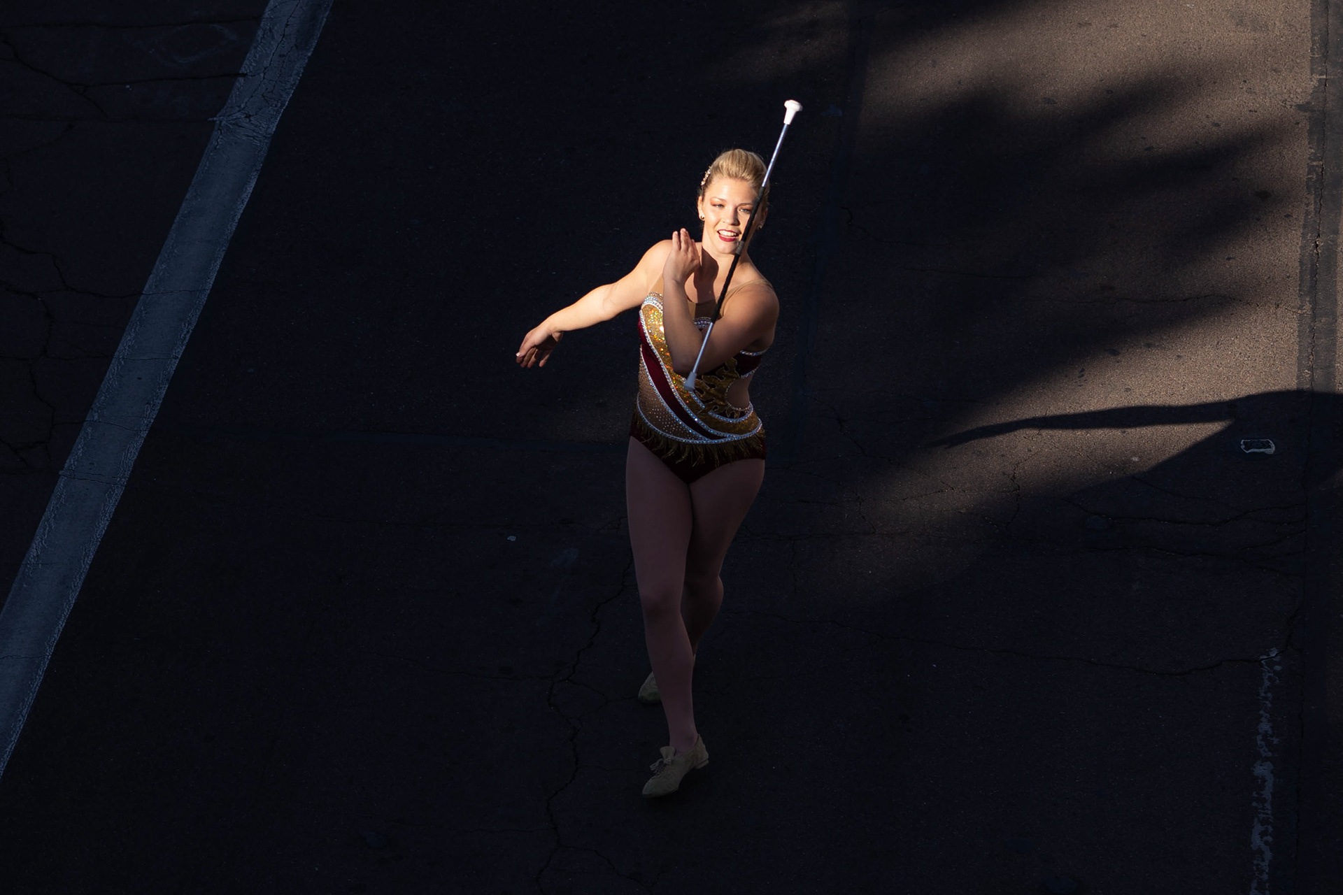 A baton twirler performs during the Homecoming parade in Tempe, Ariz. on Oct. 30, 2021. Samantha Chow/Arizona State University. (Samantha Chow/Arizona State University)