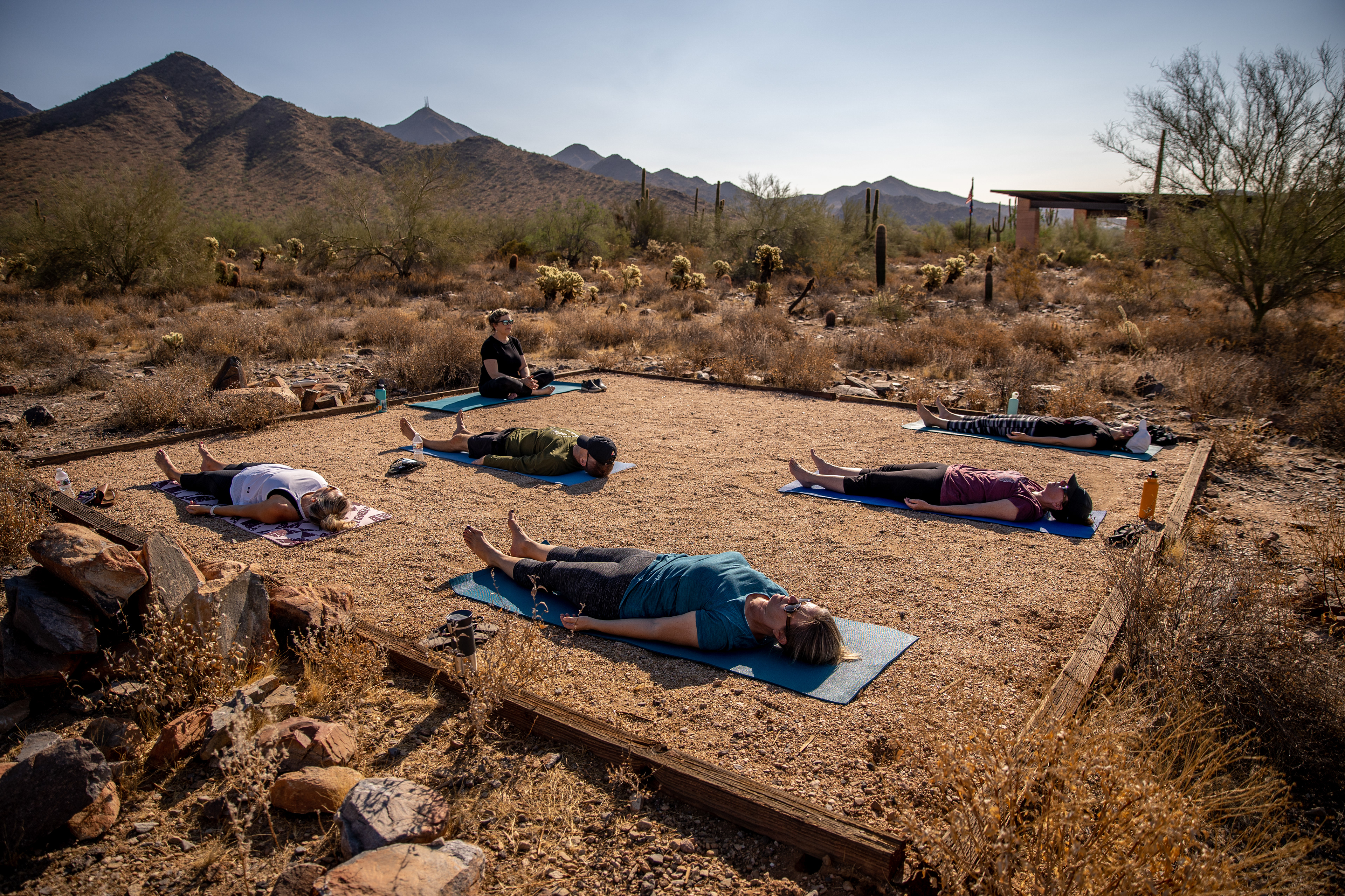 Yoga instructor Brigitte Yancy holds class outdoors at the McDowell Sonoran Preserve Gateway Trailhead in Scottsdale, Ariz. on Oct. 18, 2020. (Photo by Samantha Chow/PHOENIX Magazine)