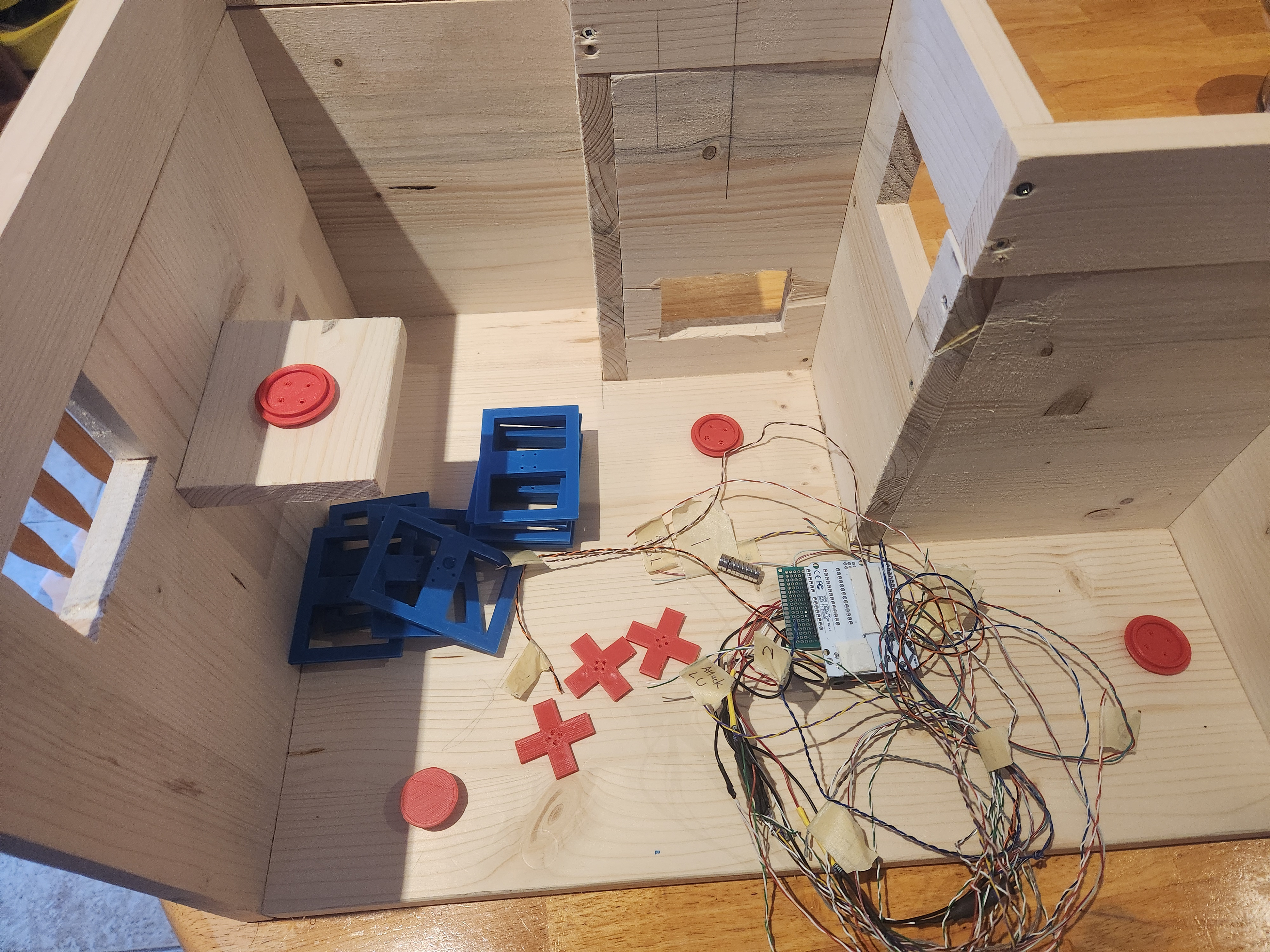 After I proved the design with the two prototypes, I started building a third prototype with improvements: wooden construction, more reliable input systems, and colour-coded pieces for easy identification.