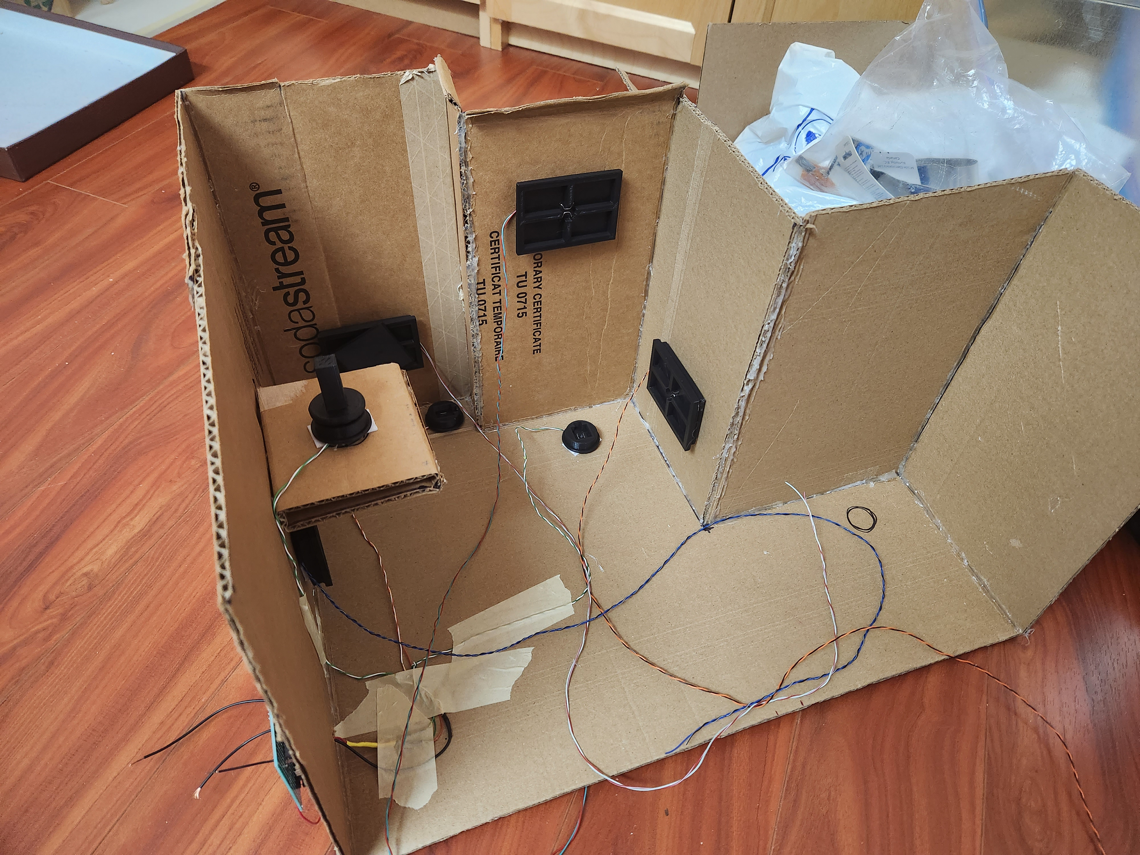 The second prototype was built full size, at a 1:1 layout with the digital level. This made it easier to test ergonomics of the final product (e.g. does the player have enough room to move the pieces inside the cabin?)