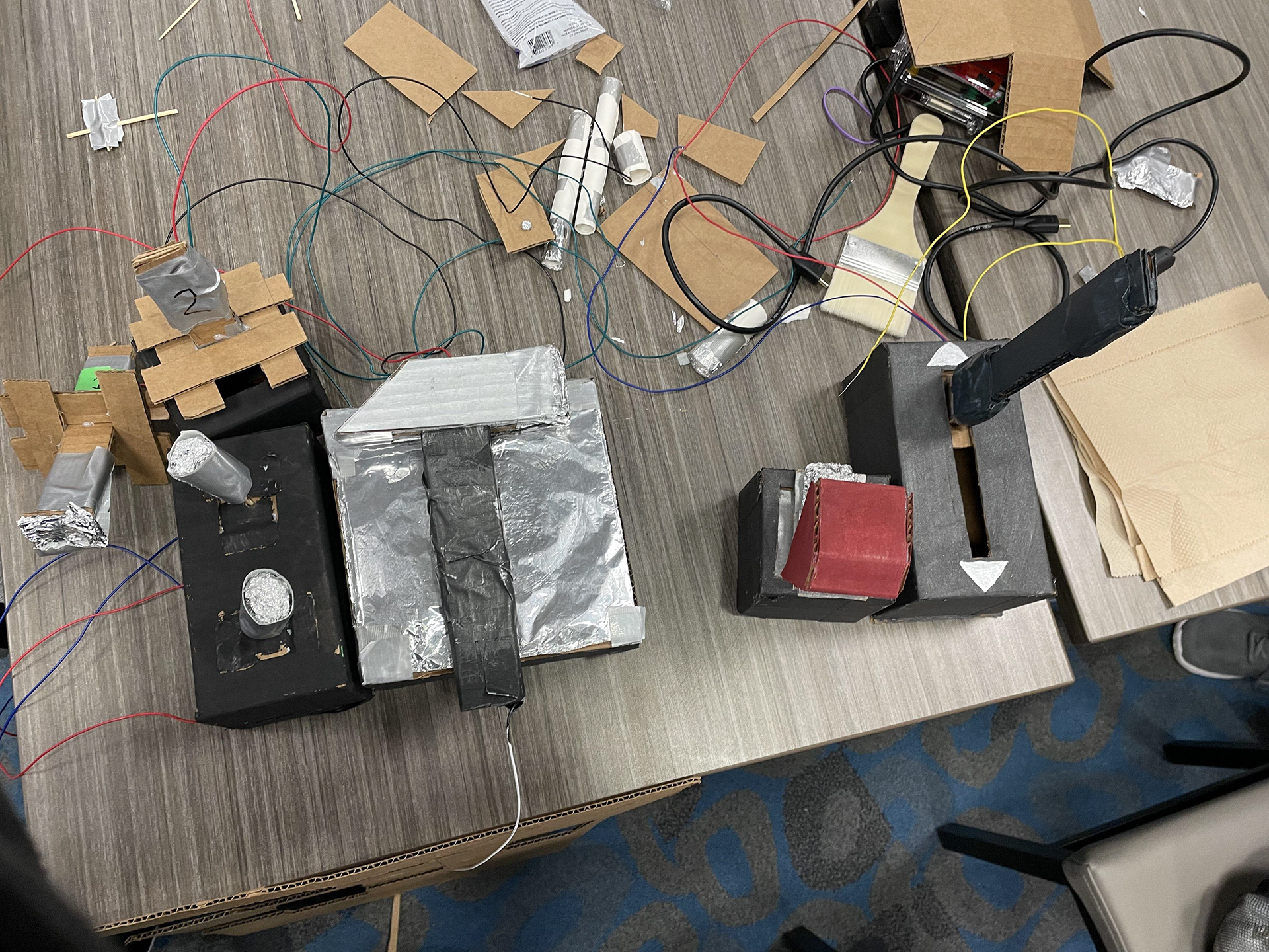 For the game jam version, controllers were roughly prototyped using cardboard. Instead of the revolving turret, gunners used a control stick to aim the turret. Instead of multiple repair plates, Mechanics used a control panel to select which part to target.