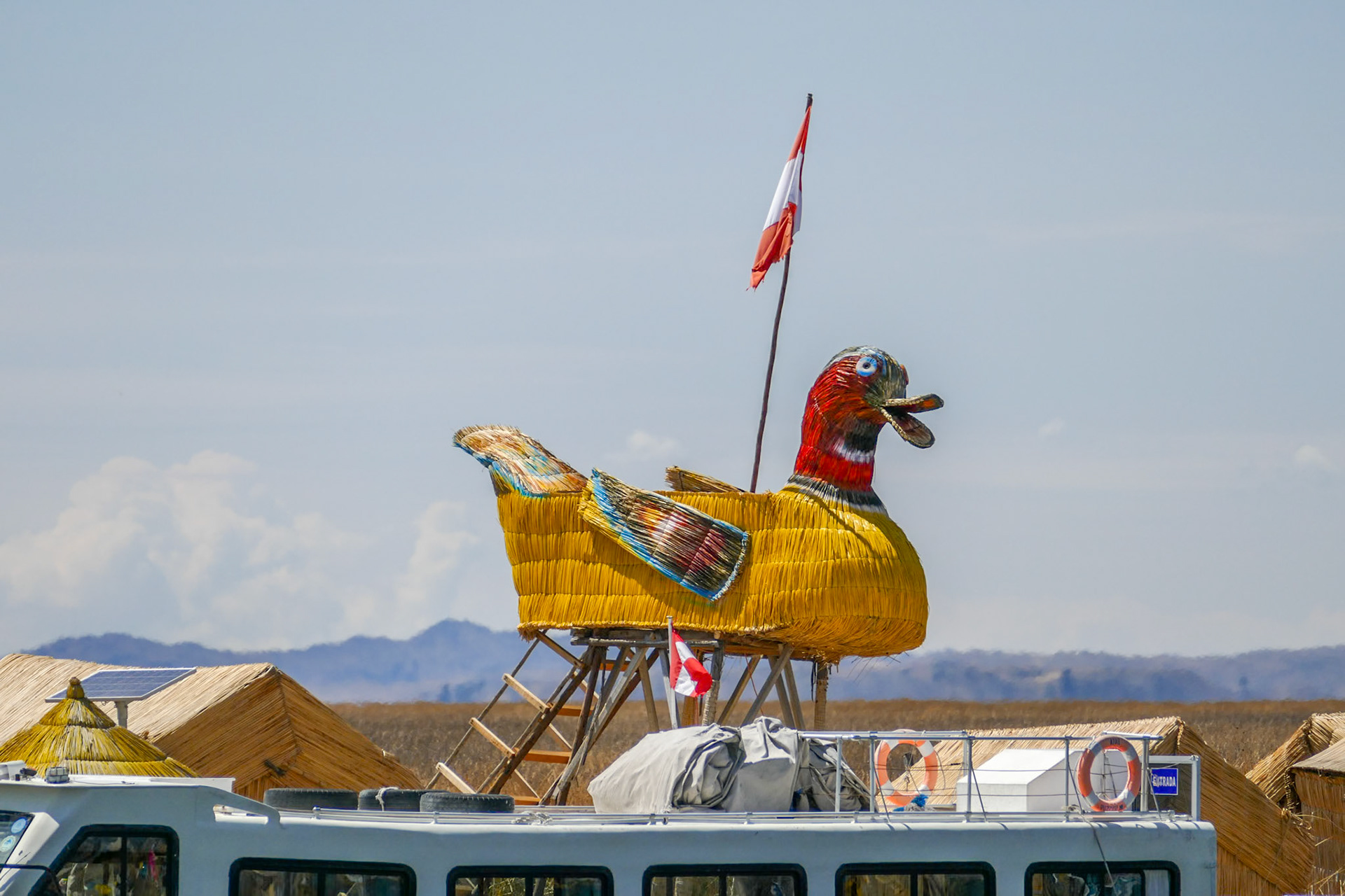 A Visit to the reed village, Uros.The reeds provide most of the building materials for traditional houses (and the occasional artwork for the tourists)
