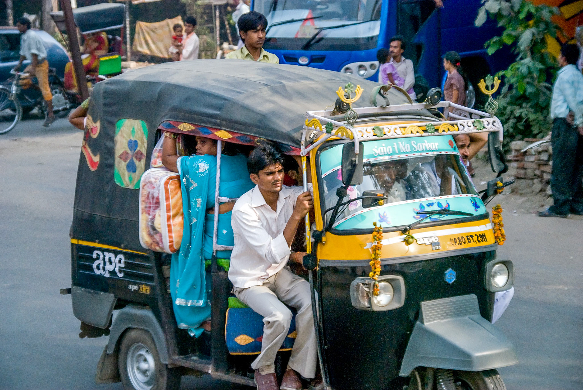 WIth a Tuk Tuk, anything goes (and usually accompanied by huge quantities of anything that needs a ride). In this case an entire family and a complete set of bedding!