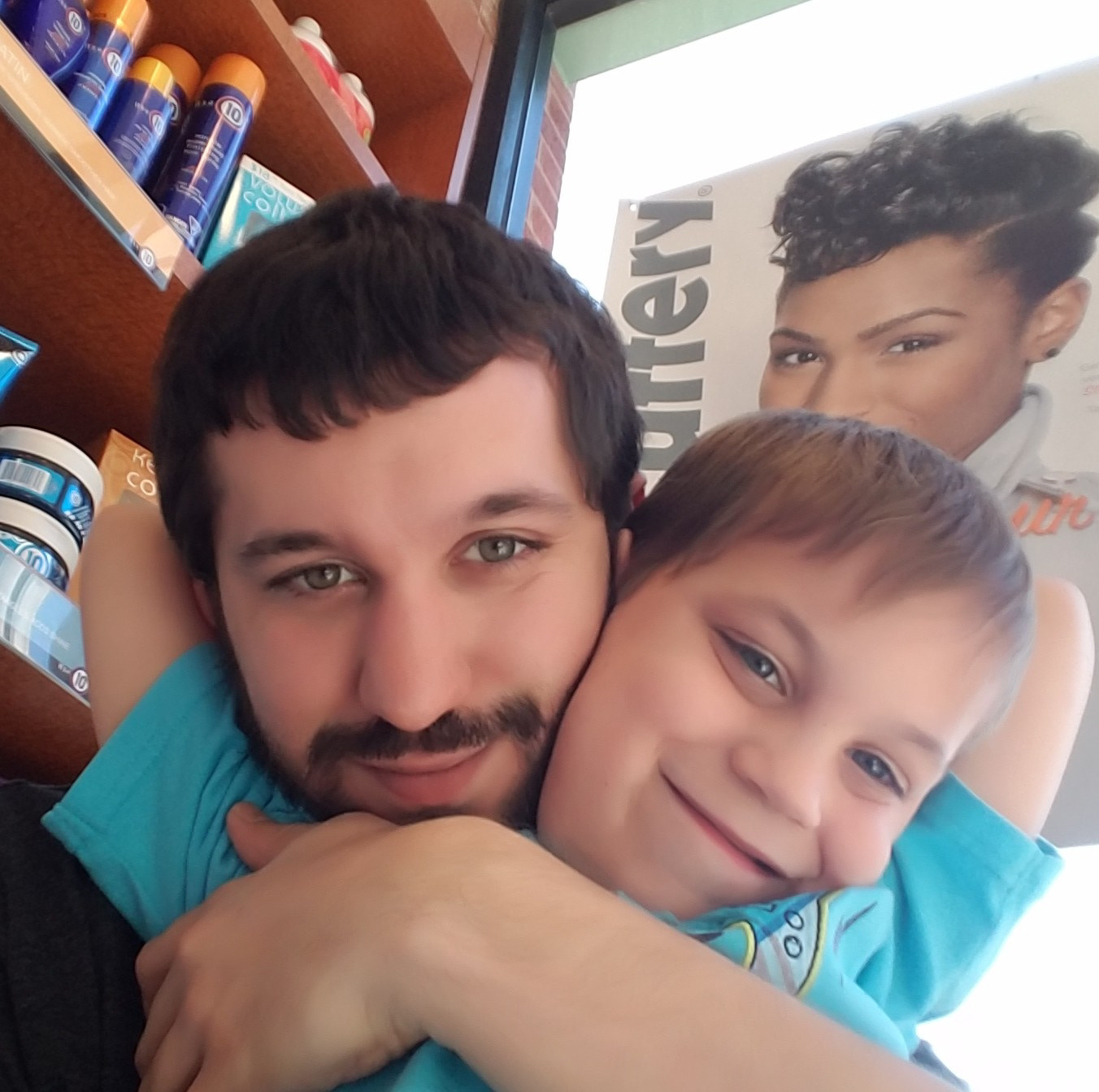 Mason and I waiting on hair cuts