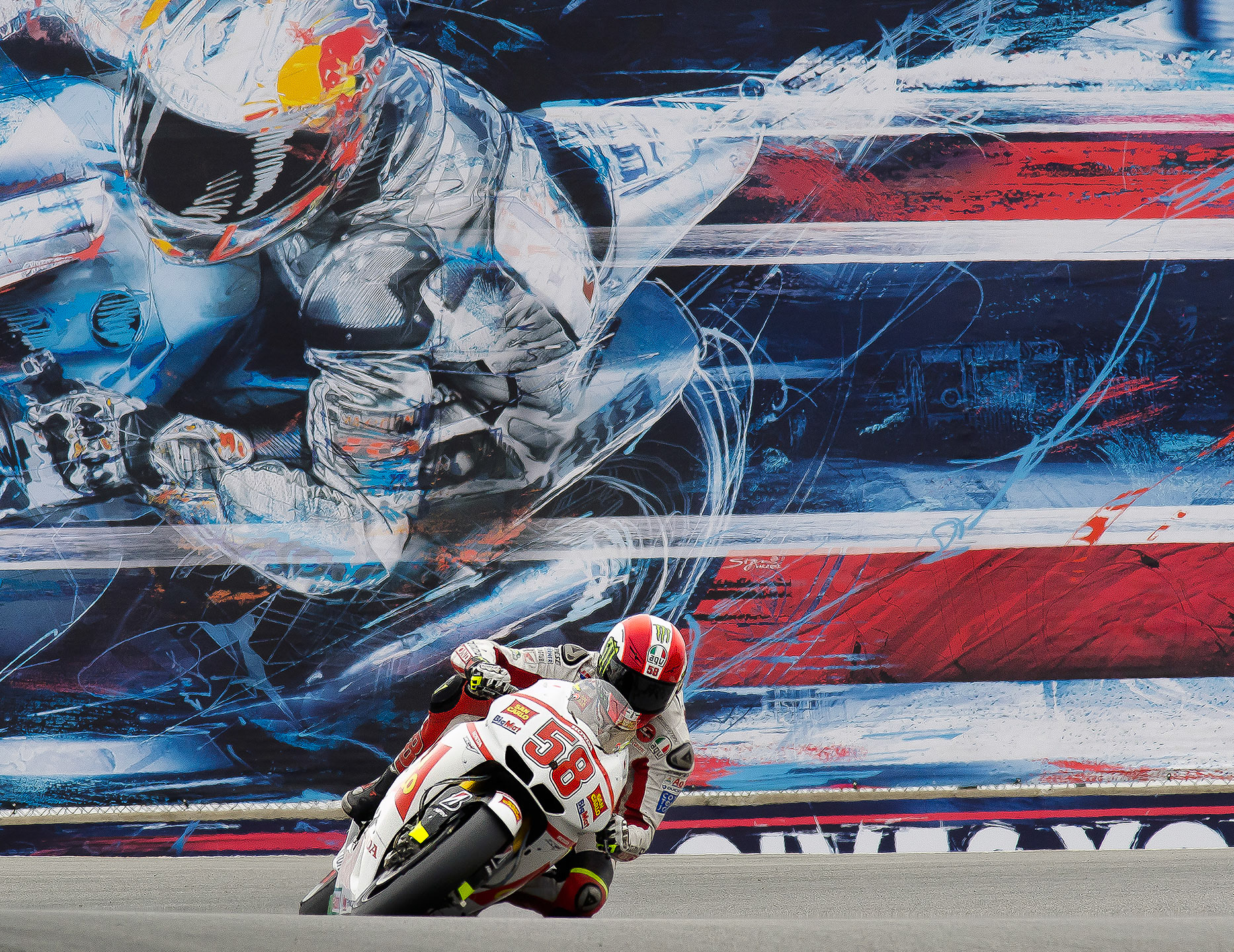 Marco Simoncelli leans into the top of the Corkscrew turns at the 2011 Laguna Seca MotoGP
