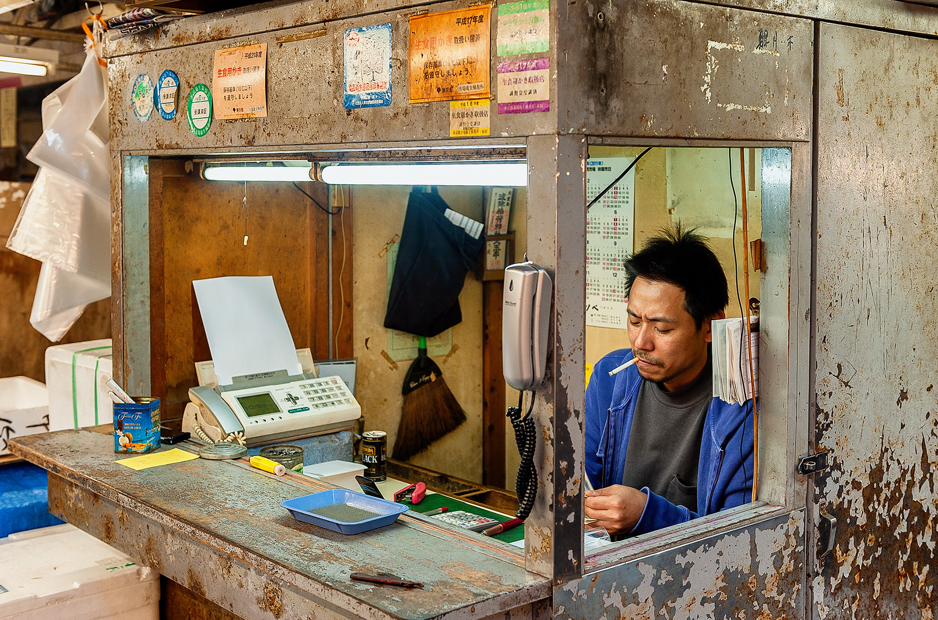 Counting the receipts after another day in Tsukiji Market