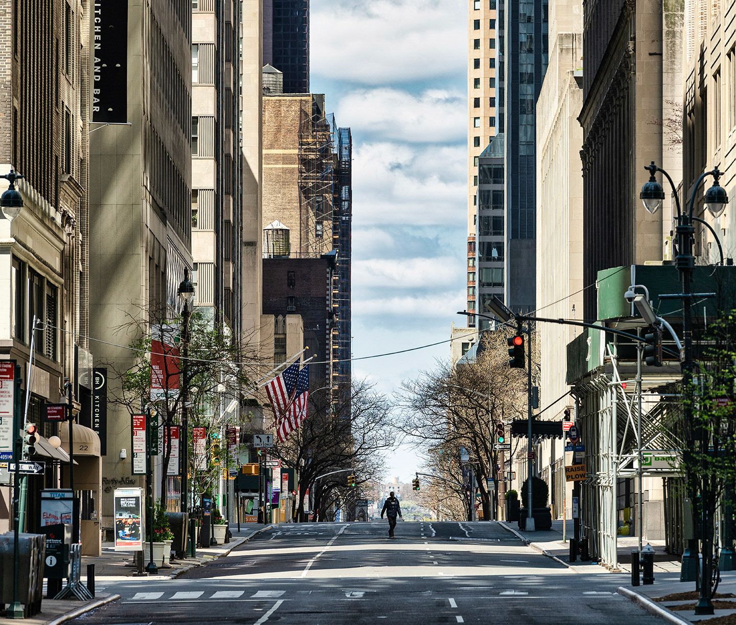 A man walks casually in the middle of the street during COVID19 lock down in NYC