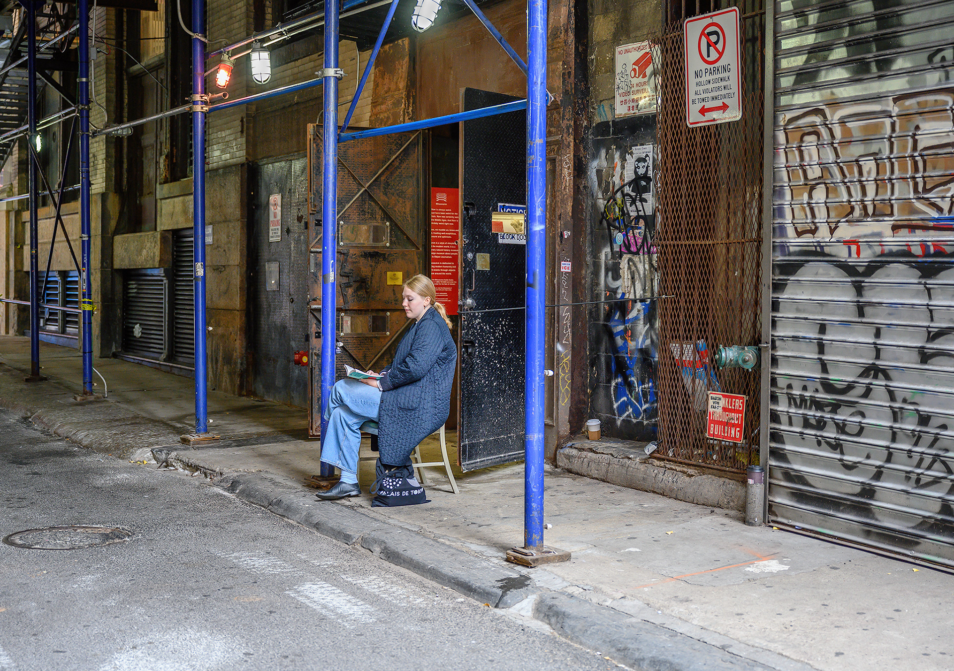 Reading in a quiet alley of Tribeca