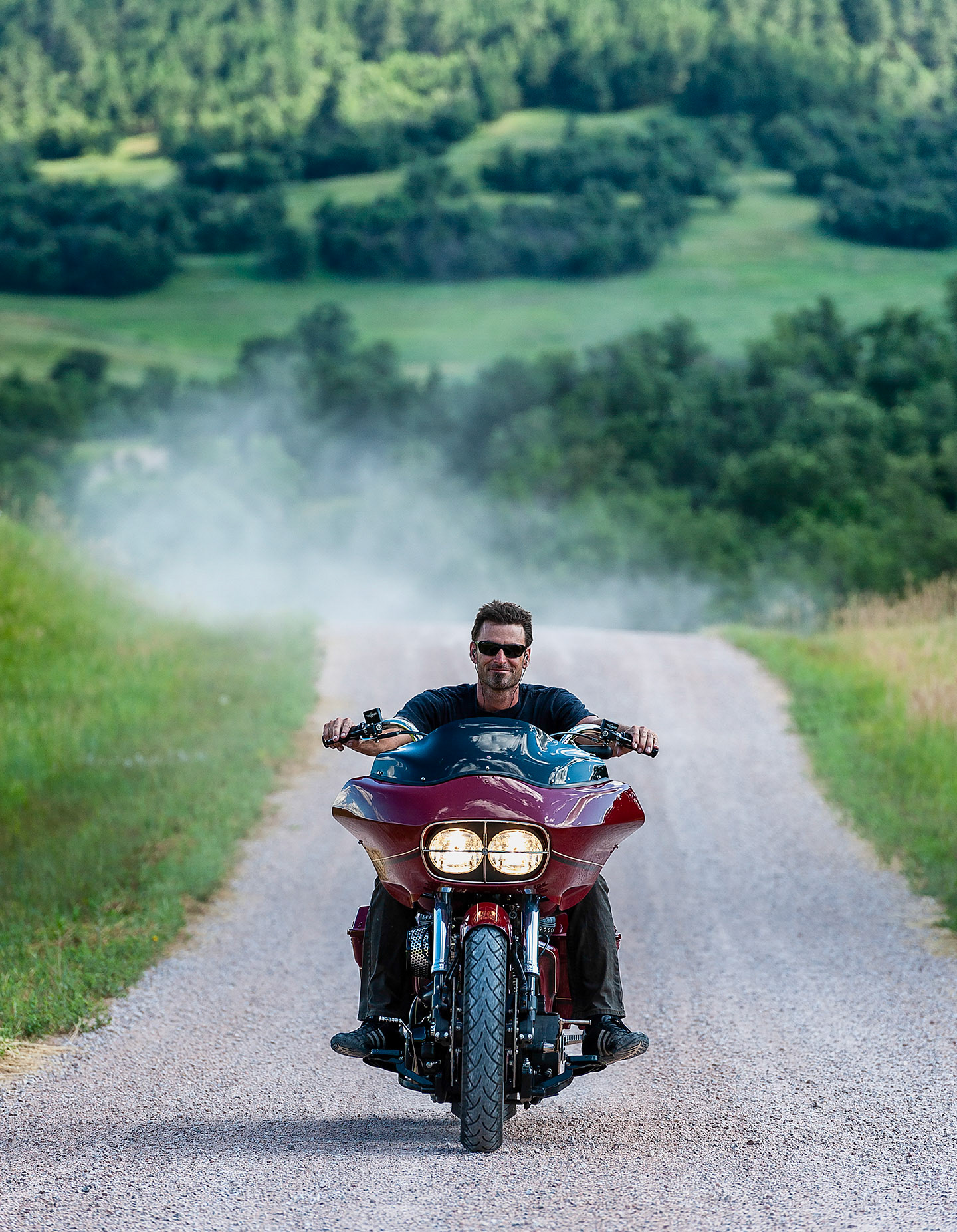 Bryan Fuller rides a custom Harley Bagger on a South Dakota gravel road