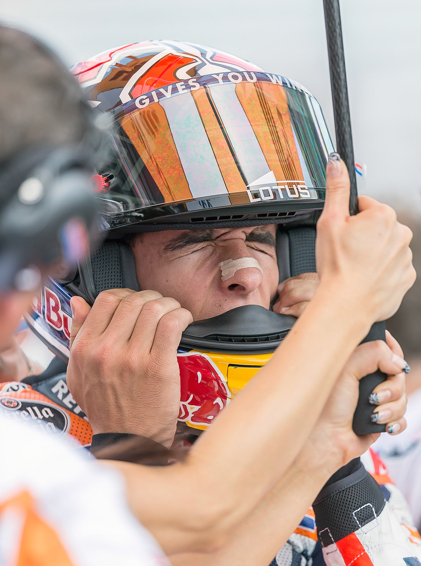 Marc Marquez don's his helmet prior to the start of  MotoGP.