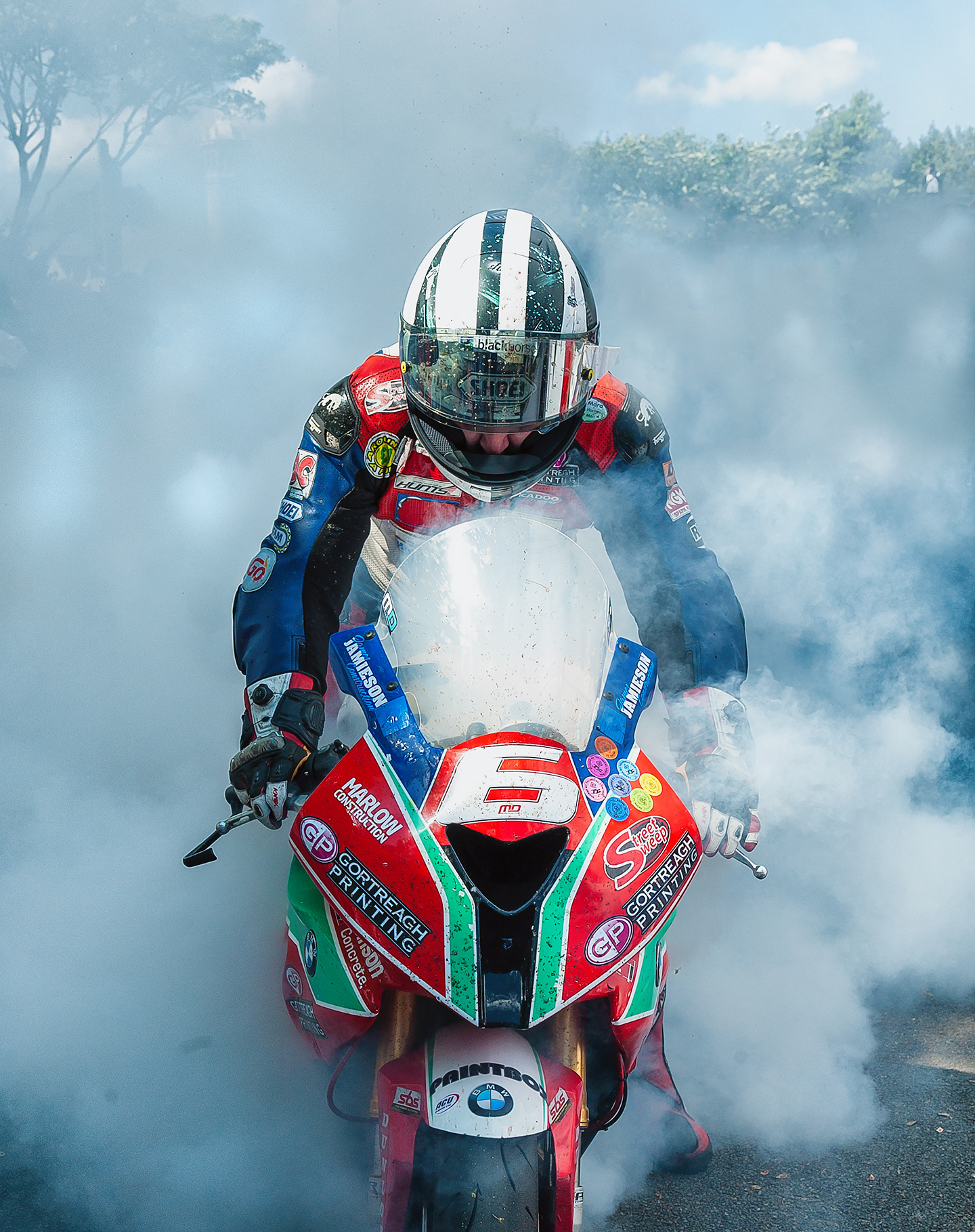 Michael Dunlop celebrates in winners circle
