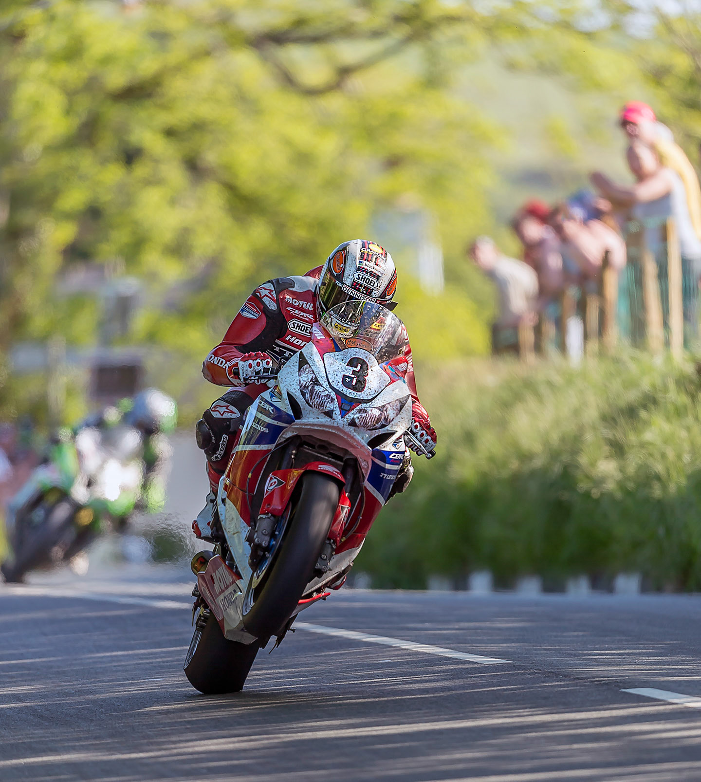 John McGuinness, wheel up over Barregarre at the Isle of Man TT