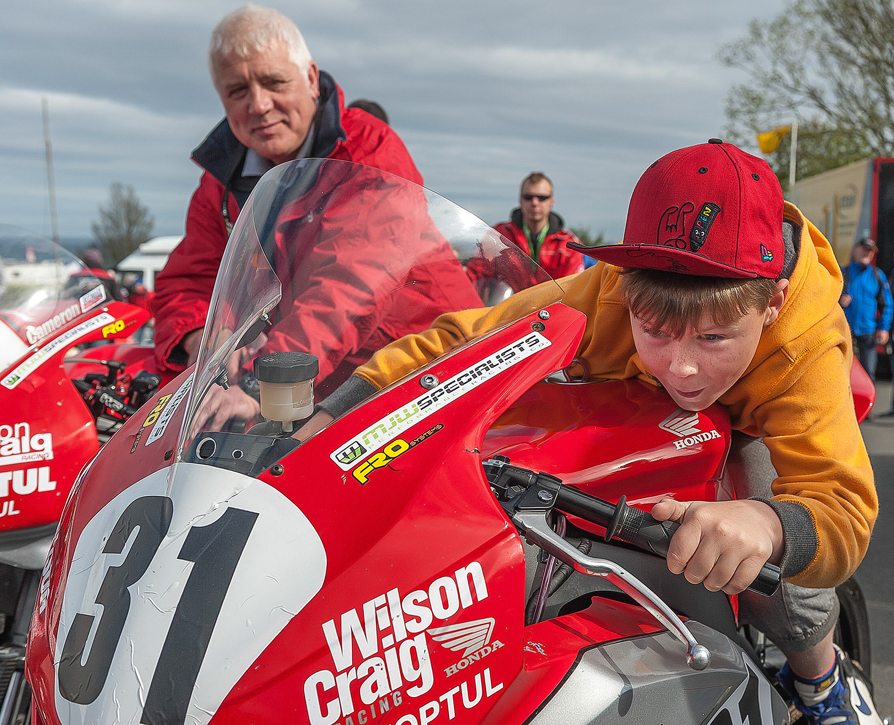 Wilson Craig Racing rider training starts at a young age as I found this wee lad in the scrutineering line at the 2013 Isle of Man TT.