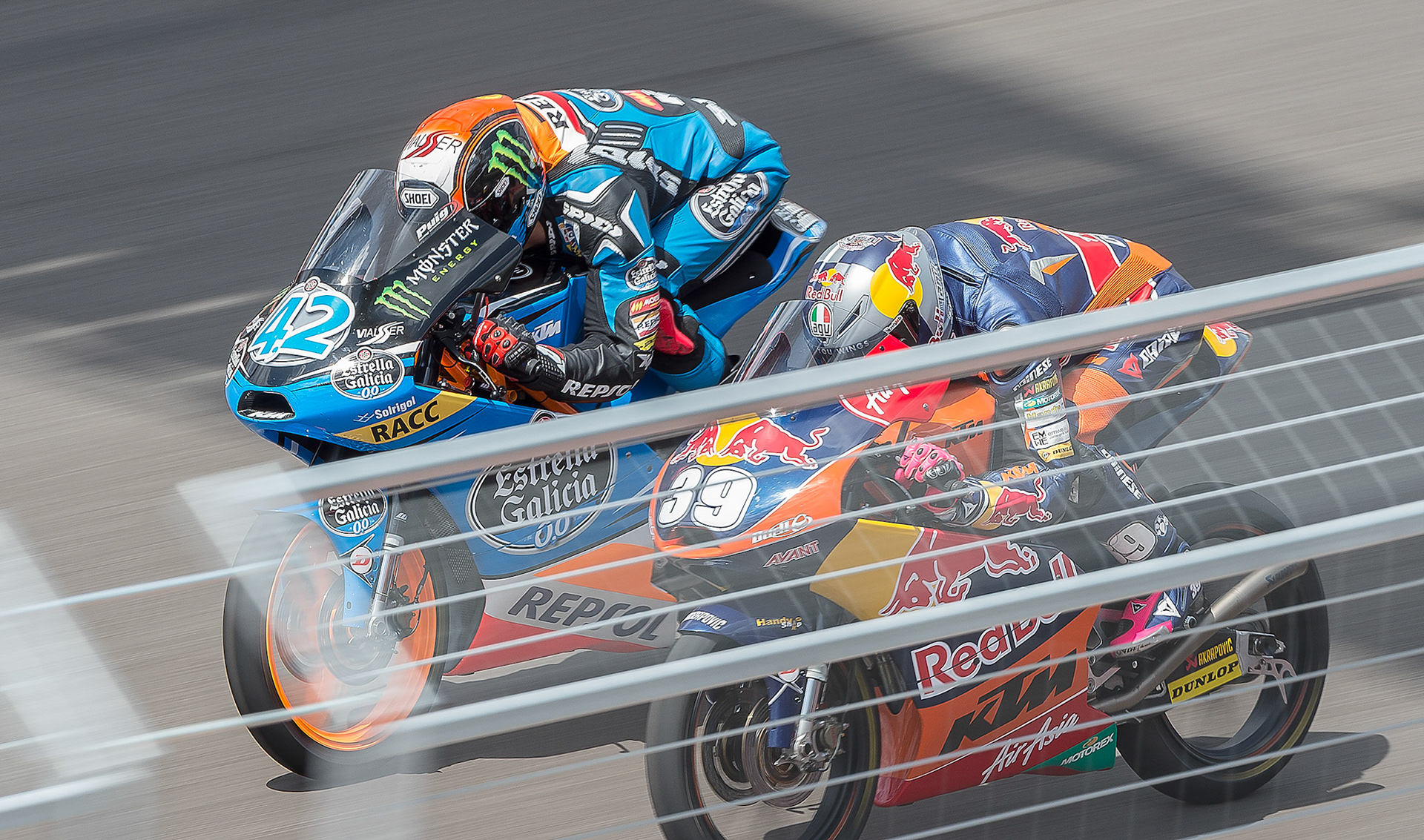Alex Rin (42) battles Luis Salom down the front straight at Circuit of the America's during the Red Bull Grand Prix of the America's Moto3 race. 