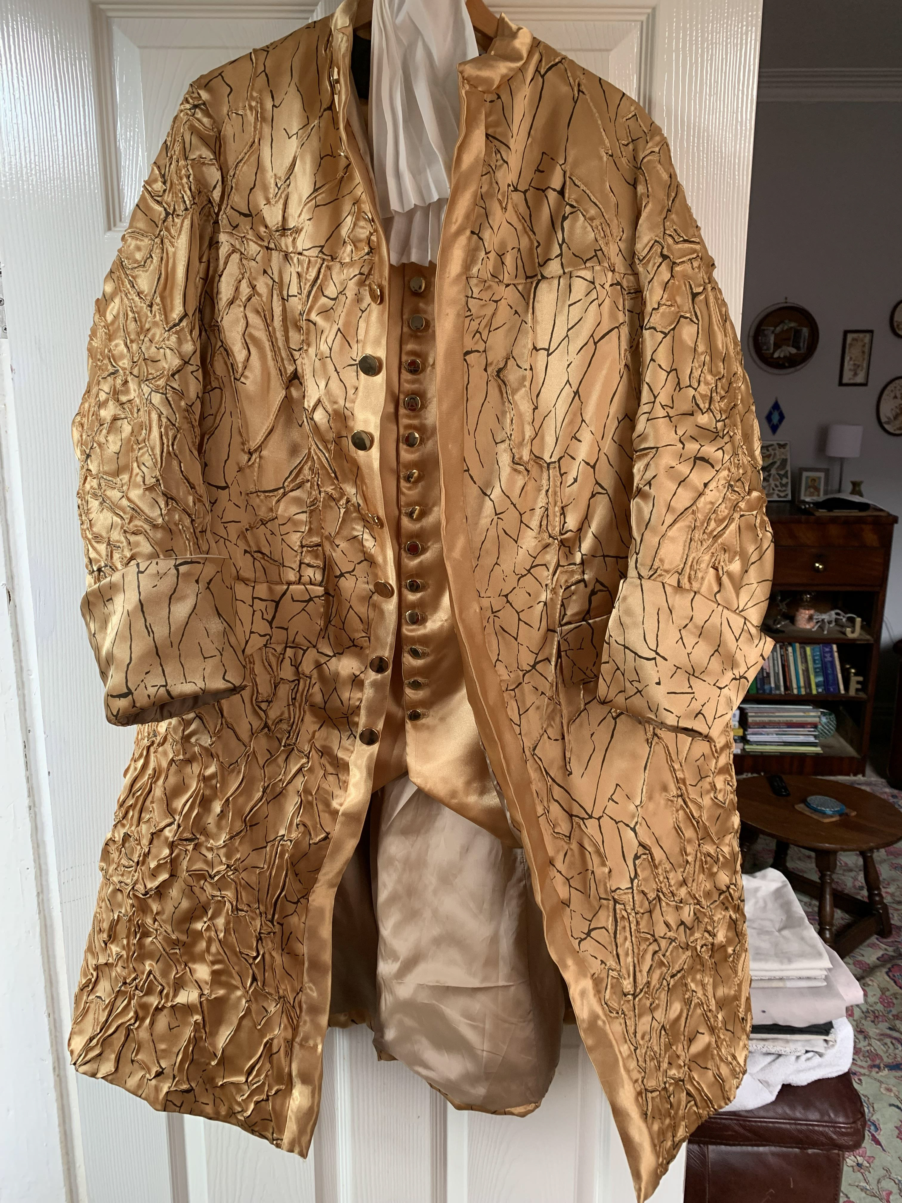 Coat textiles were developed by printing crack design with pigment dye and pin tucking along edges of the design