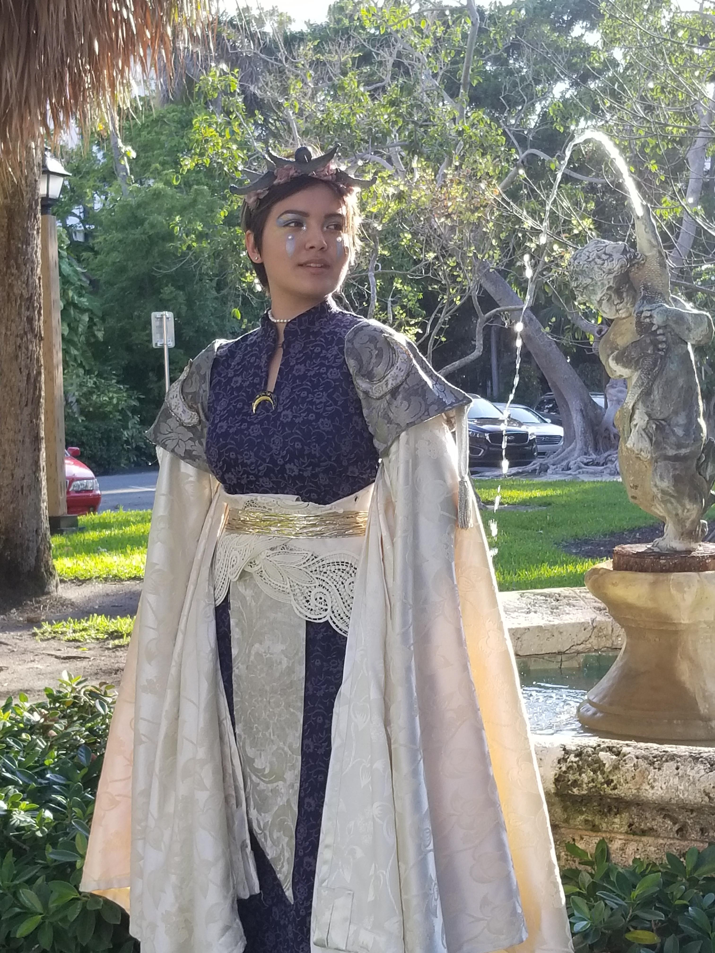 2. I found a white tablecloth with a lace design at the edges which I used as the waistband. For this, I sewed snaps to the inside of the fabric to the measurements of my model's waist, which would clasp snugly around the front of the waist. The center piece of fabric from the waistcoat was made from white suede and I sewed it to the back fold of the waistband. I bound the waistband with a gold foil ribbon.
