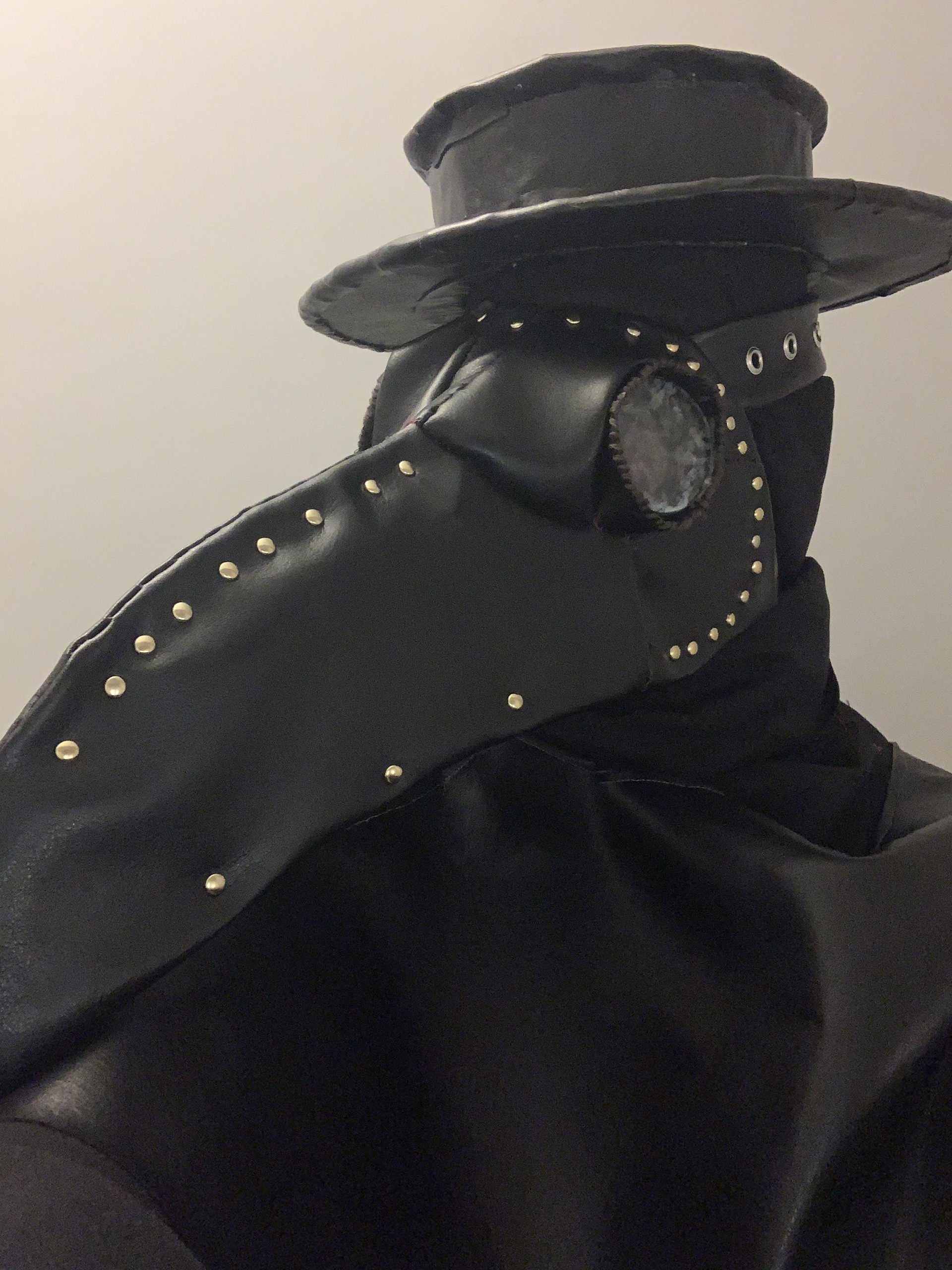 To wear the mask, I sewed a strap with clips for the back of my head. Because the form was cardboard, the mask itself was not that heavy and did not need any further support to keep it on my head.