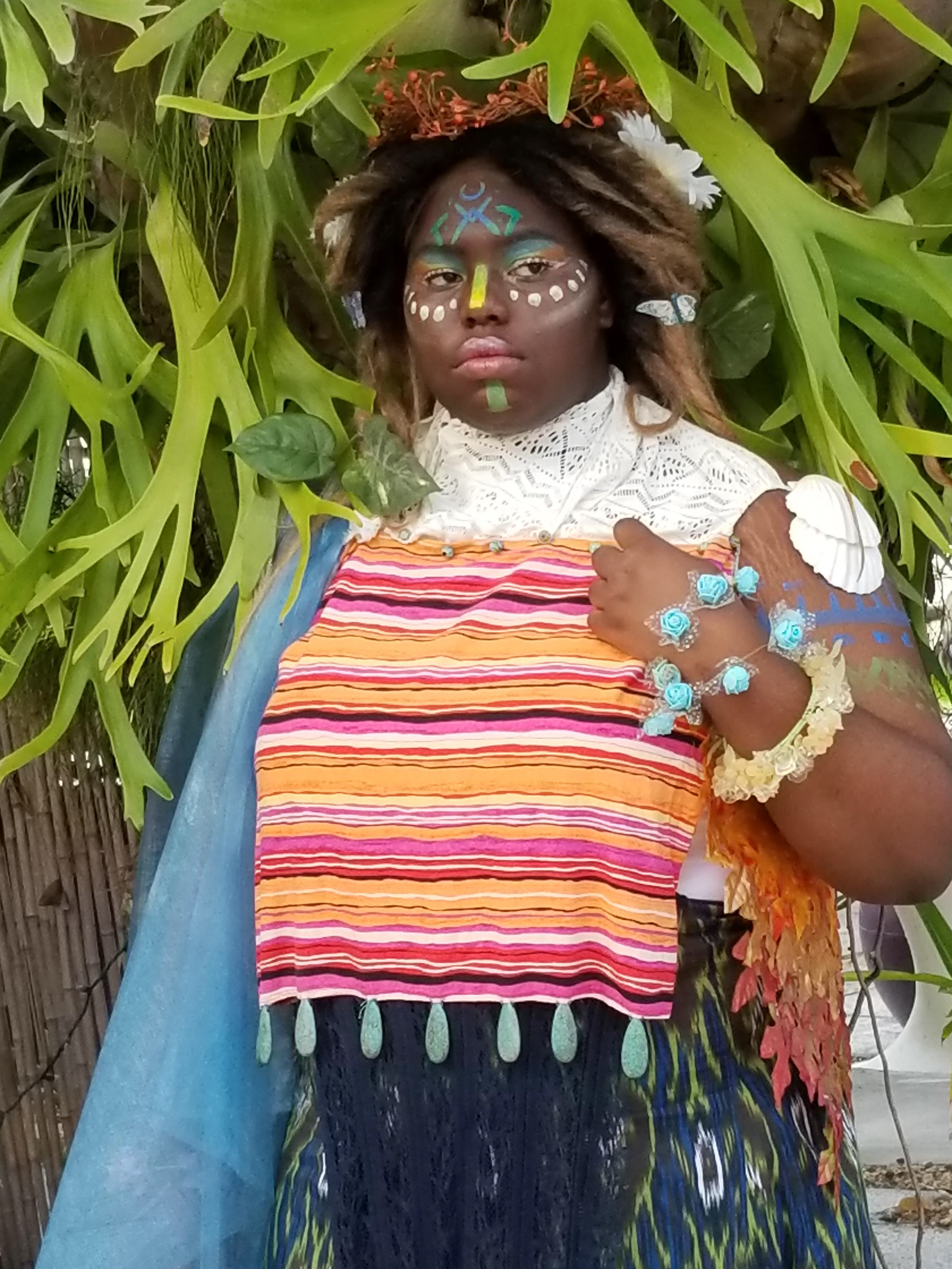 2. The white geometric lace for the neck of the top was very similar to the patterns I had seen in traditional Xhosa Umbhaco. I seam ripped the fabric from a dress and hemmed the edges, pushing the glass beads of the striped top through the holes of the lace and sewing clasps to the back of the neck so the white lace could be removed separately.