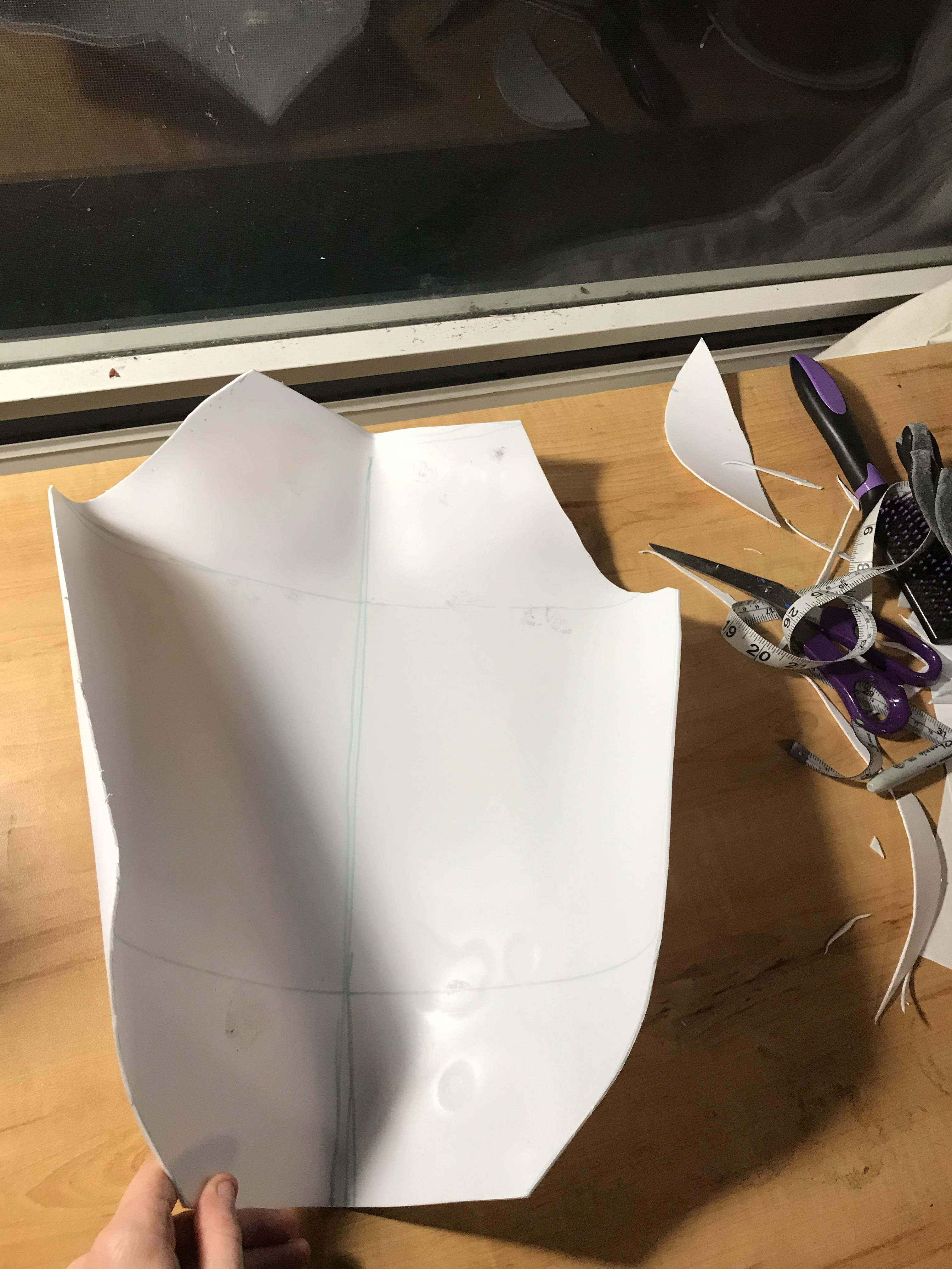 5. Next, I shaped the exact lines of the breastplate using industrial scissors.