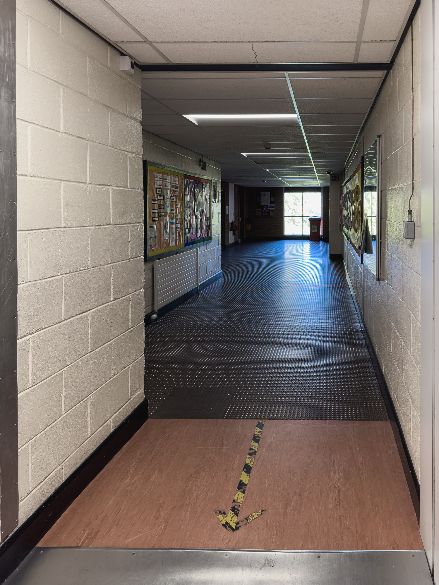 Standing outside Mrs Bottone's classroom.