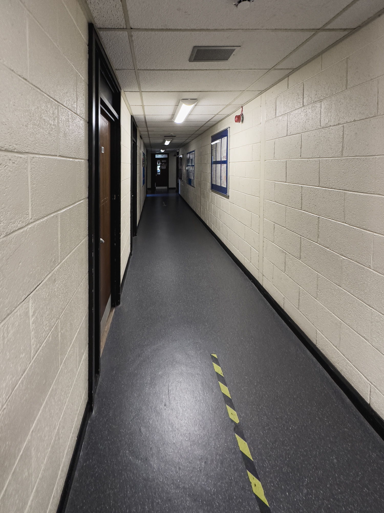 Back in the corridor heading to the long edge of the horseshoe corridors.