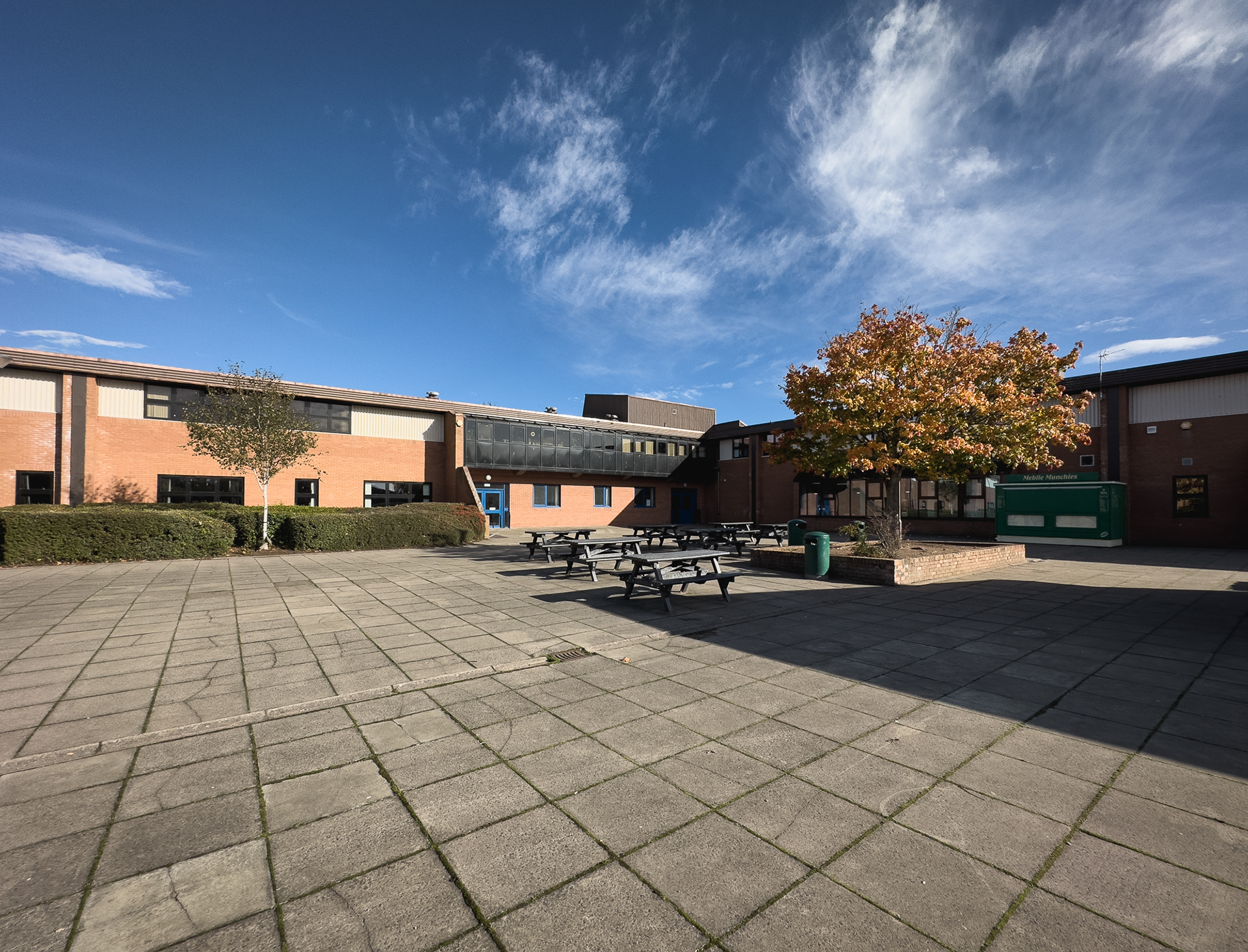 Paved area outside the school.