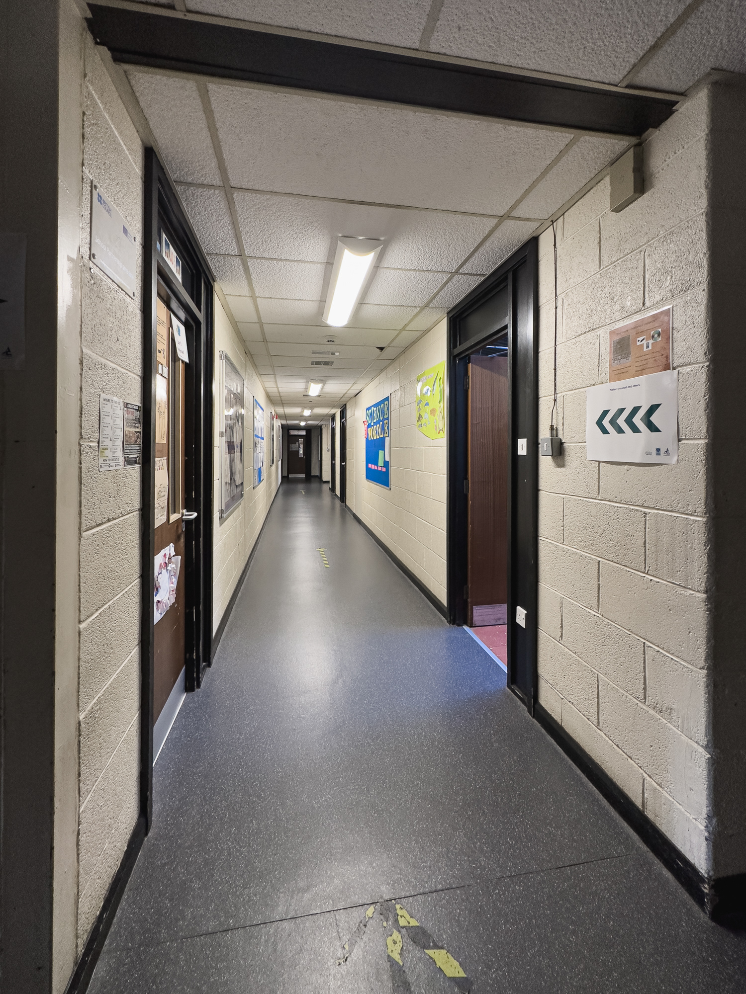 Turning the corner into the long edge of the horseshoe corridor.