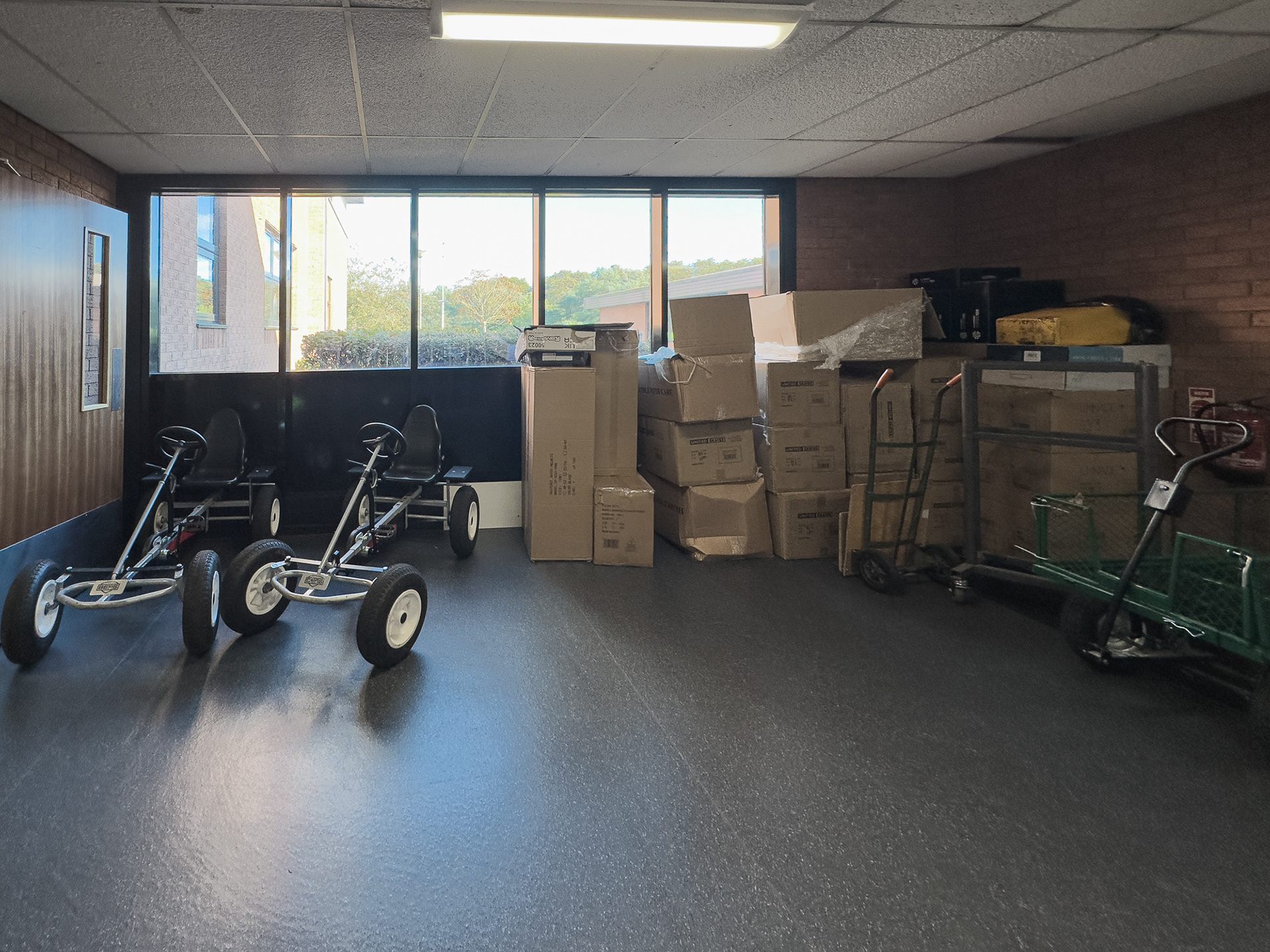 New sports equipment being unpacked in the lobby off the main hall.
