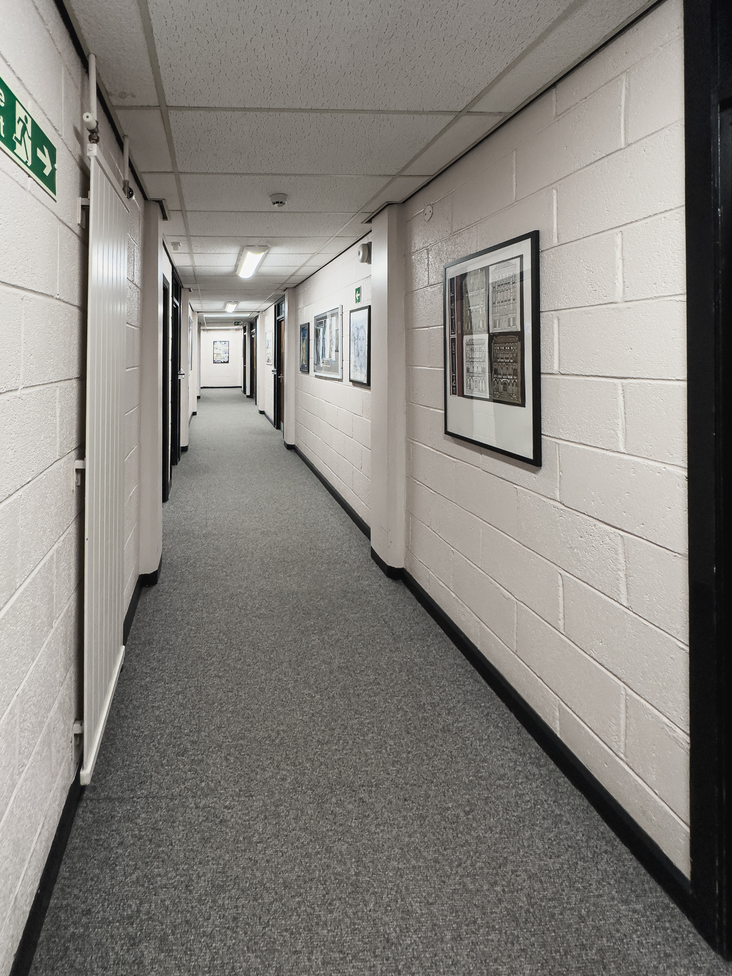 Looking back up the corridor from the social area towards the main offices.