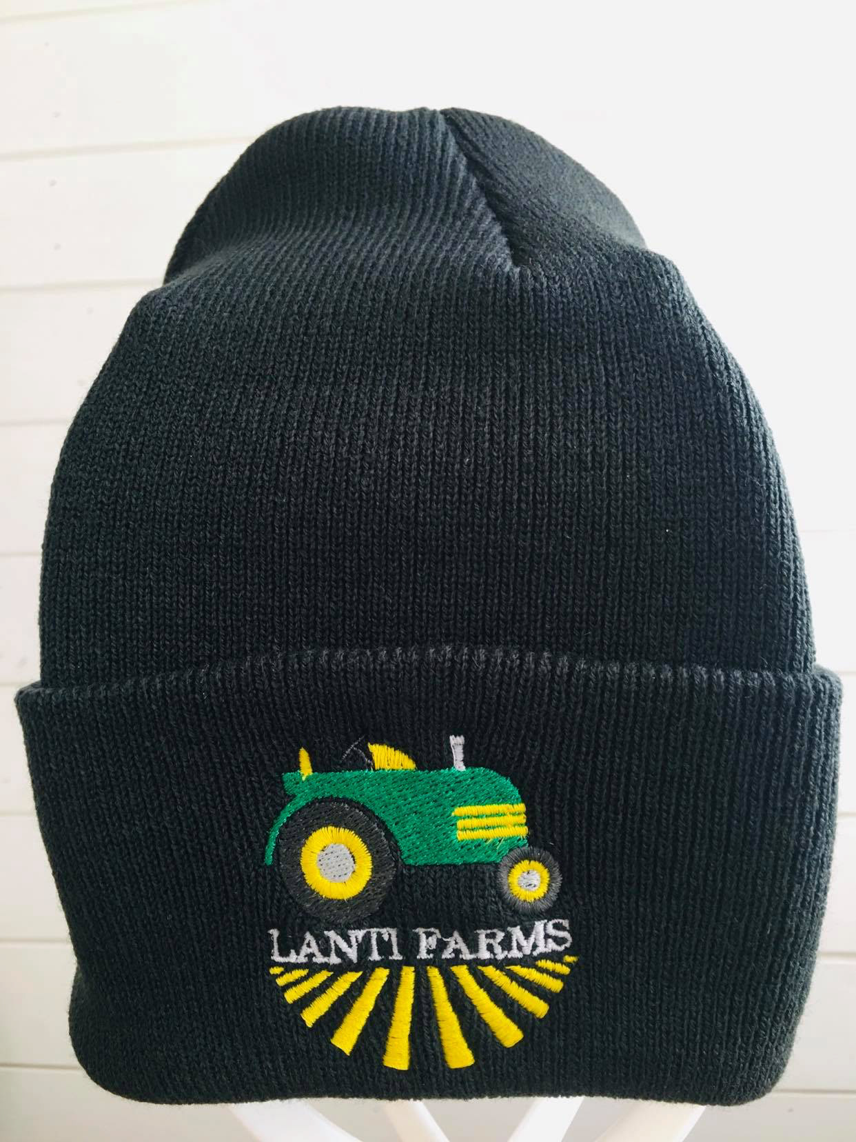 Green and yellow tractor Lanti Farms Logo on black toque hat