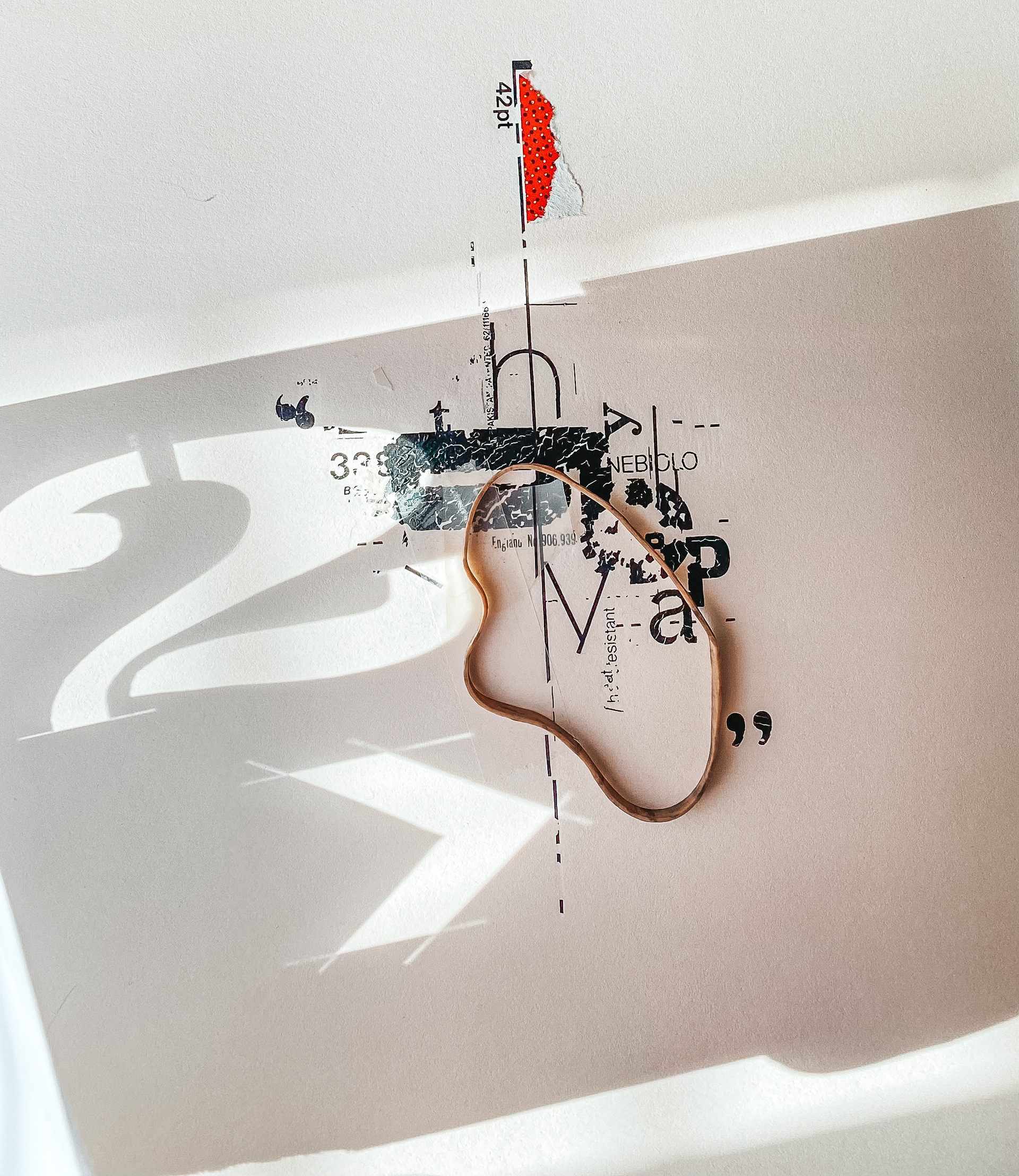 Natural light projected through stencil to create dramatic shadows