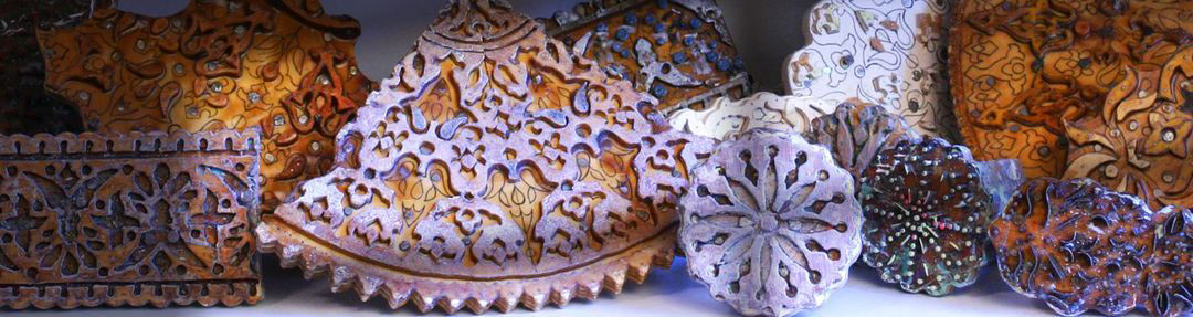 image of 9 wooden blocks carved by the artist