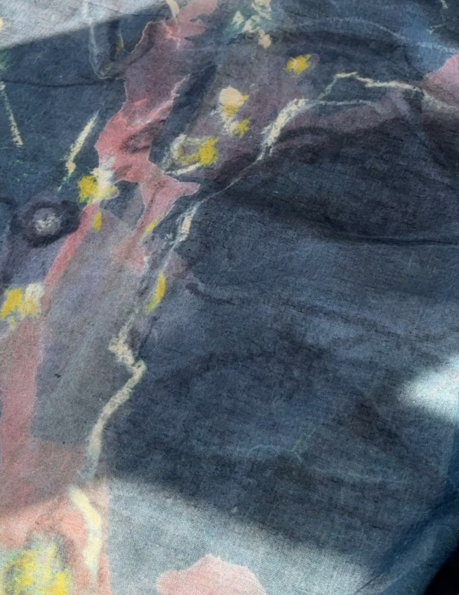 Close-up view of textile wall art: Captivating lone cypress tree against a dusky blue sky. Deep blue hues with textured trunk and subtle yellow and dusty pink accents.