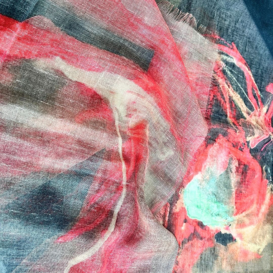 close up view of the art showing its vibrant red and warm greys 