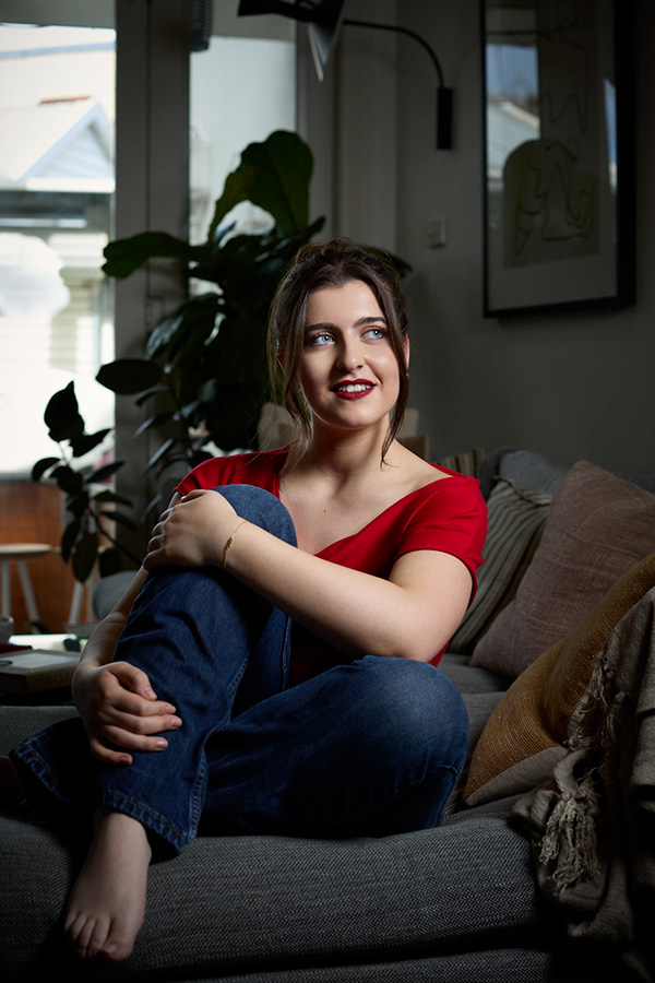 Editorial seated portrait in a cafe setting