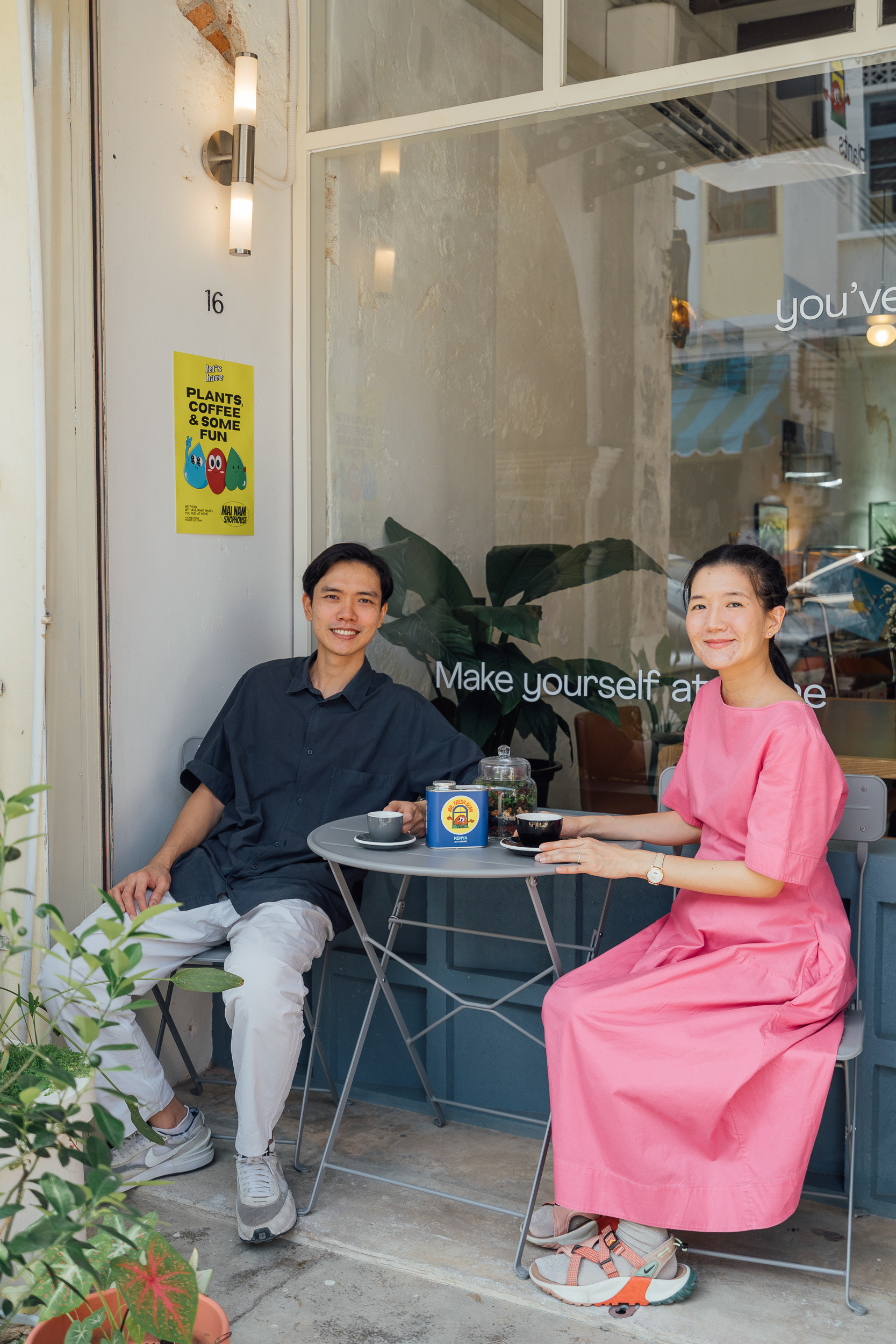 Photo of the shop owner and his girlfriend in front of the shop.