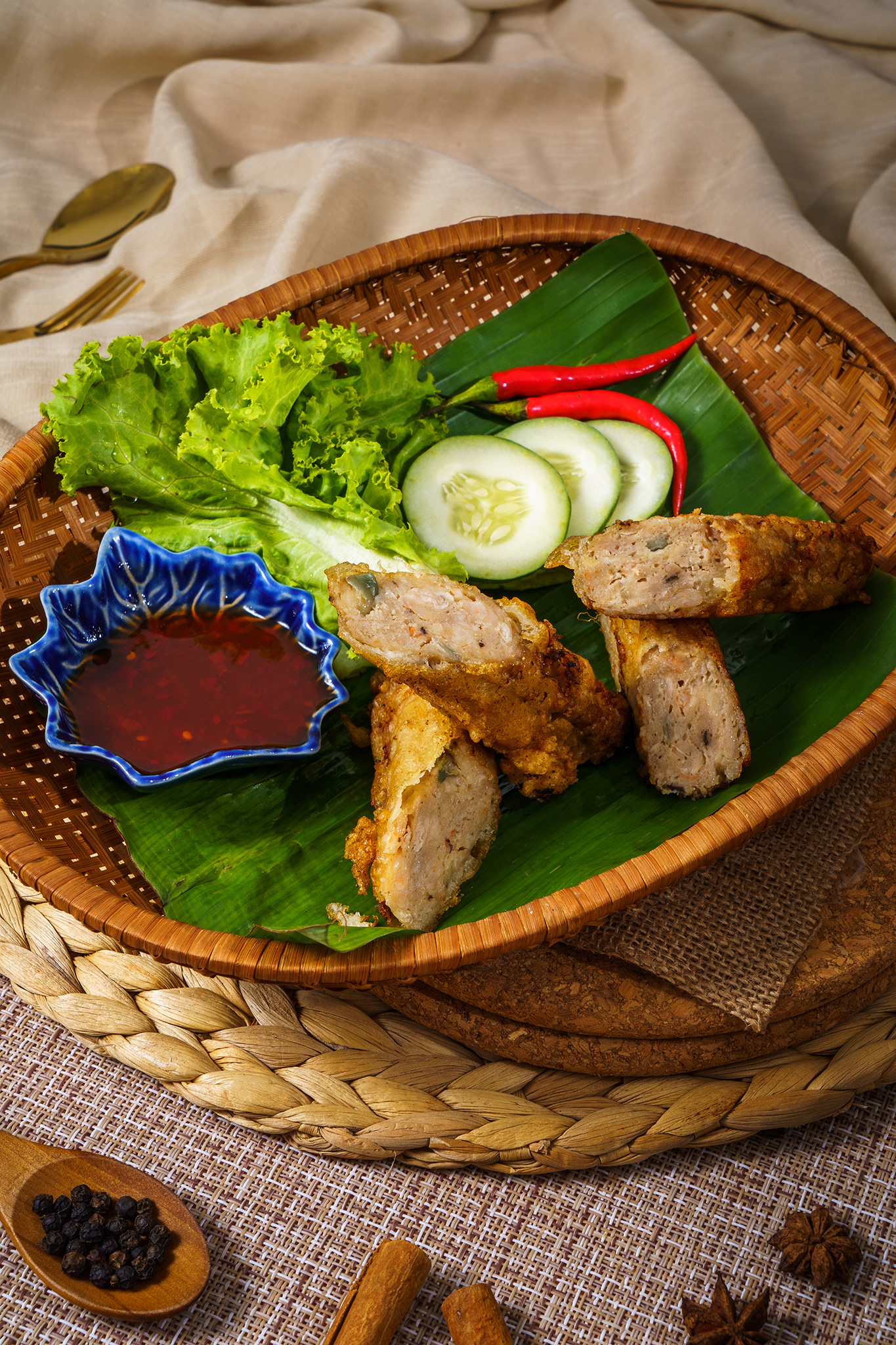 Pork meat traditional sausages, food of Phuket Thailand with spicy dipping sauce lettuce and chili