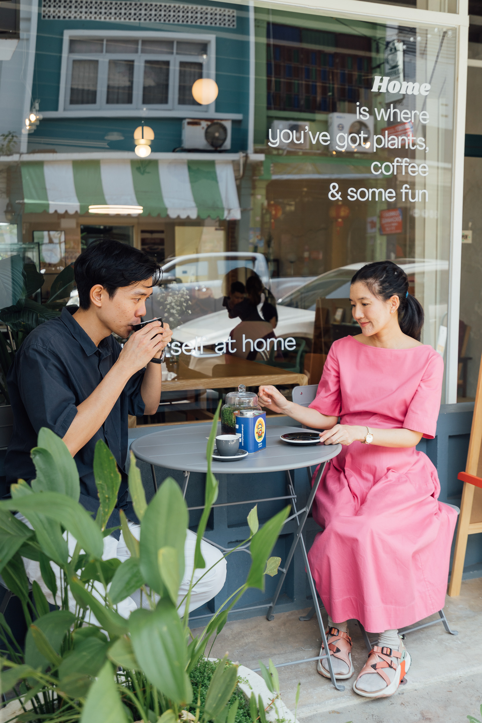Photo of the shop owner and his girlfriend in front of the shop.