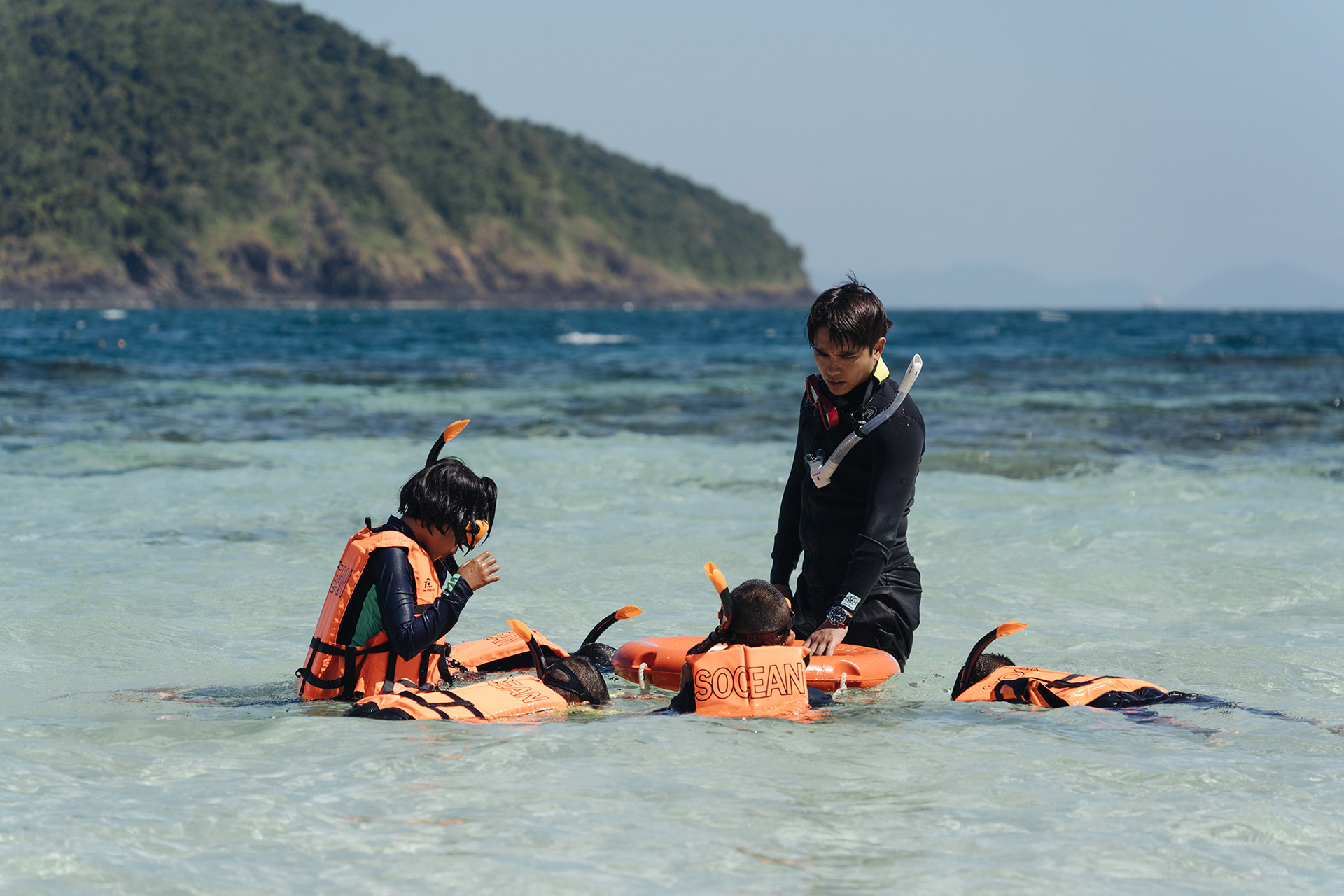 Alex Rendell teaches schoolchildren about snorkeling at Coral Island, Phuket.