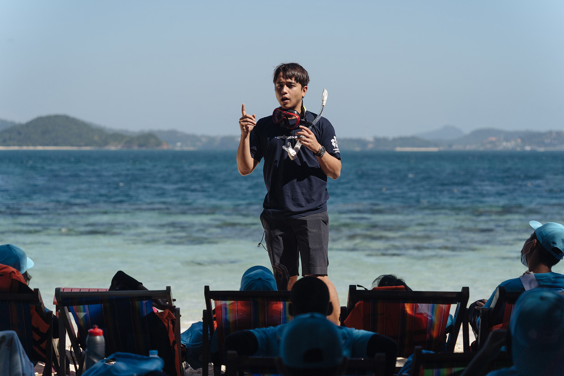 Alex Rendell lectures schoolchildren about snorkeling at Coral Island, Phuket.