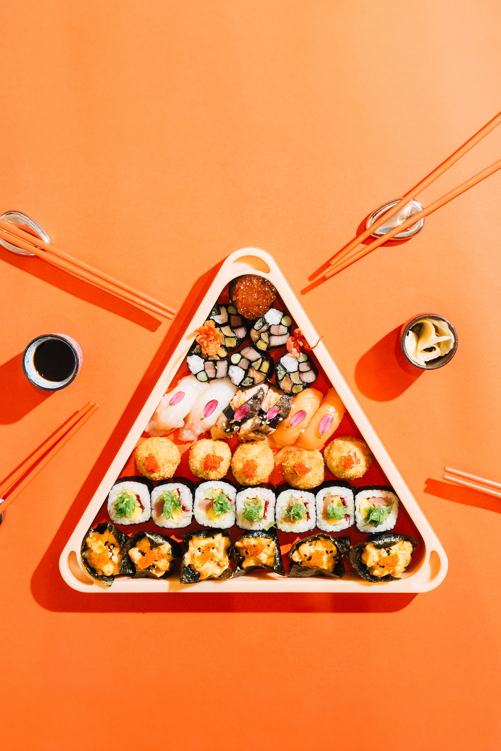 Creative photography of sushi on an orange background