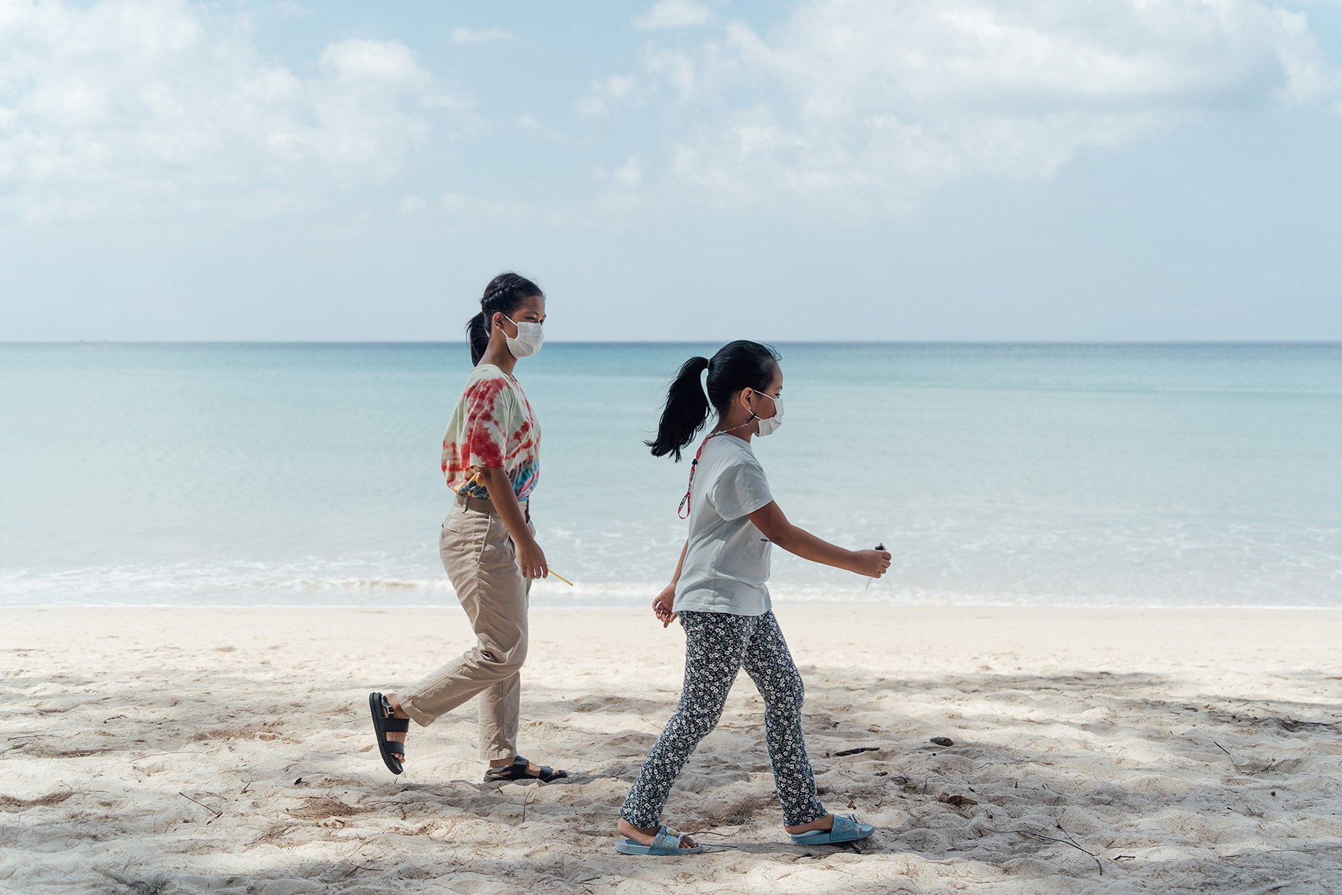 The students who came for the interview were walking on the beach.