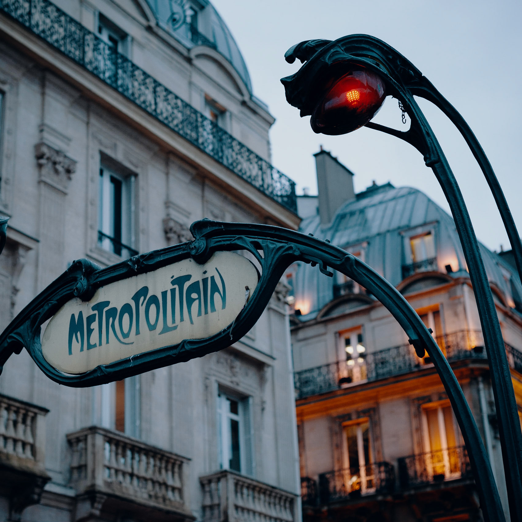 A turn of the century métro entrance lit from within by LEDs.