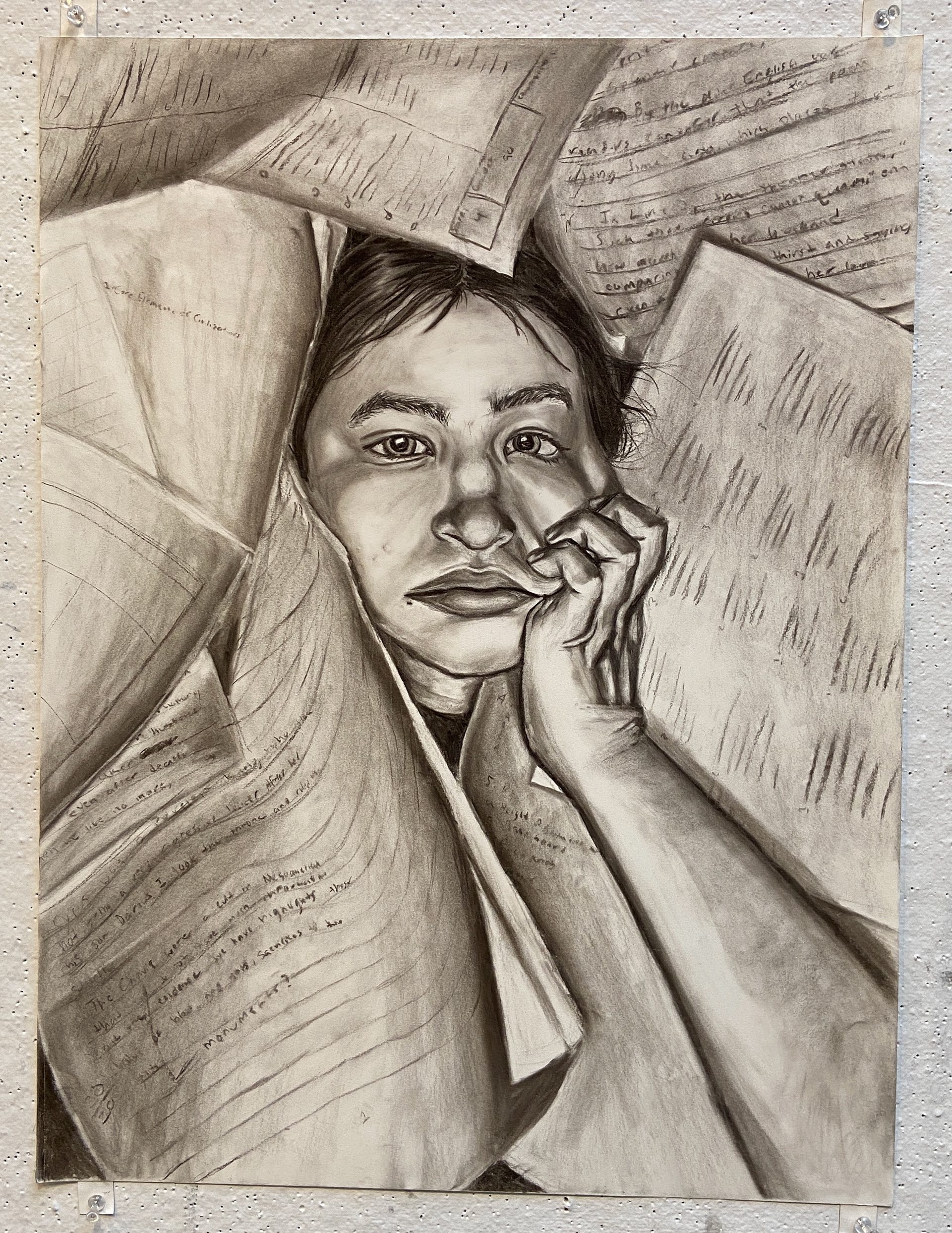 Self-portrait in charcoal. Depicting the stress and feeling of "drowning" in assignments during finals season. Drawing I Final.