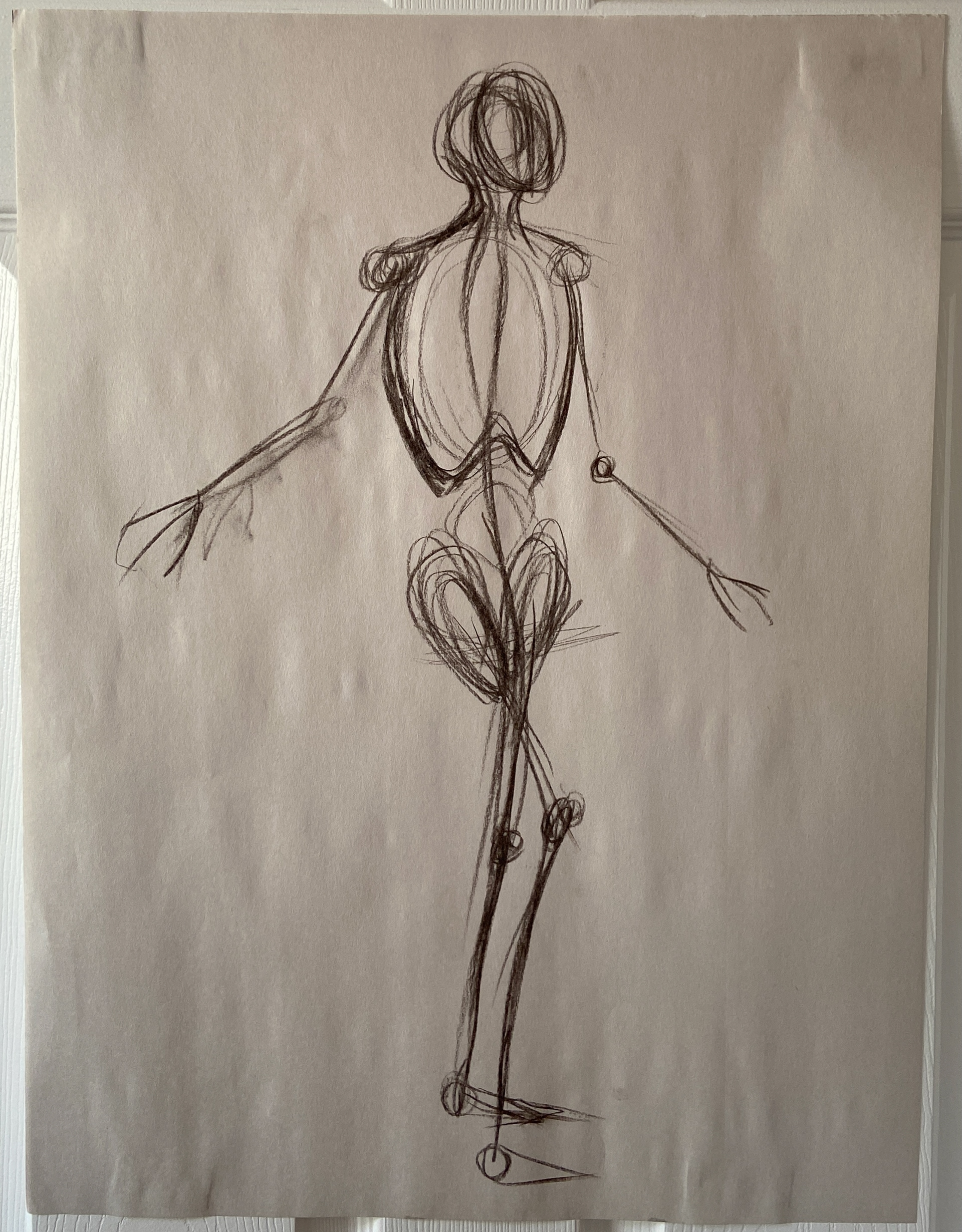 Figure gesture drawing in charcoal.