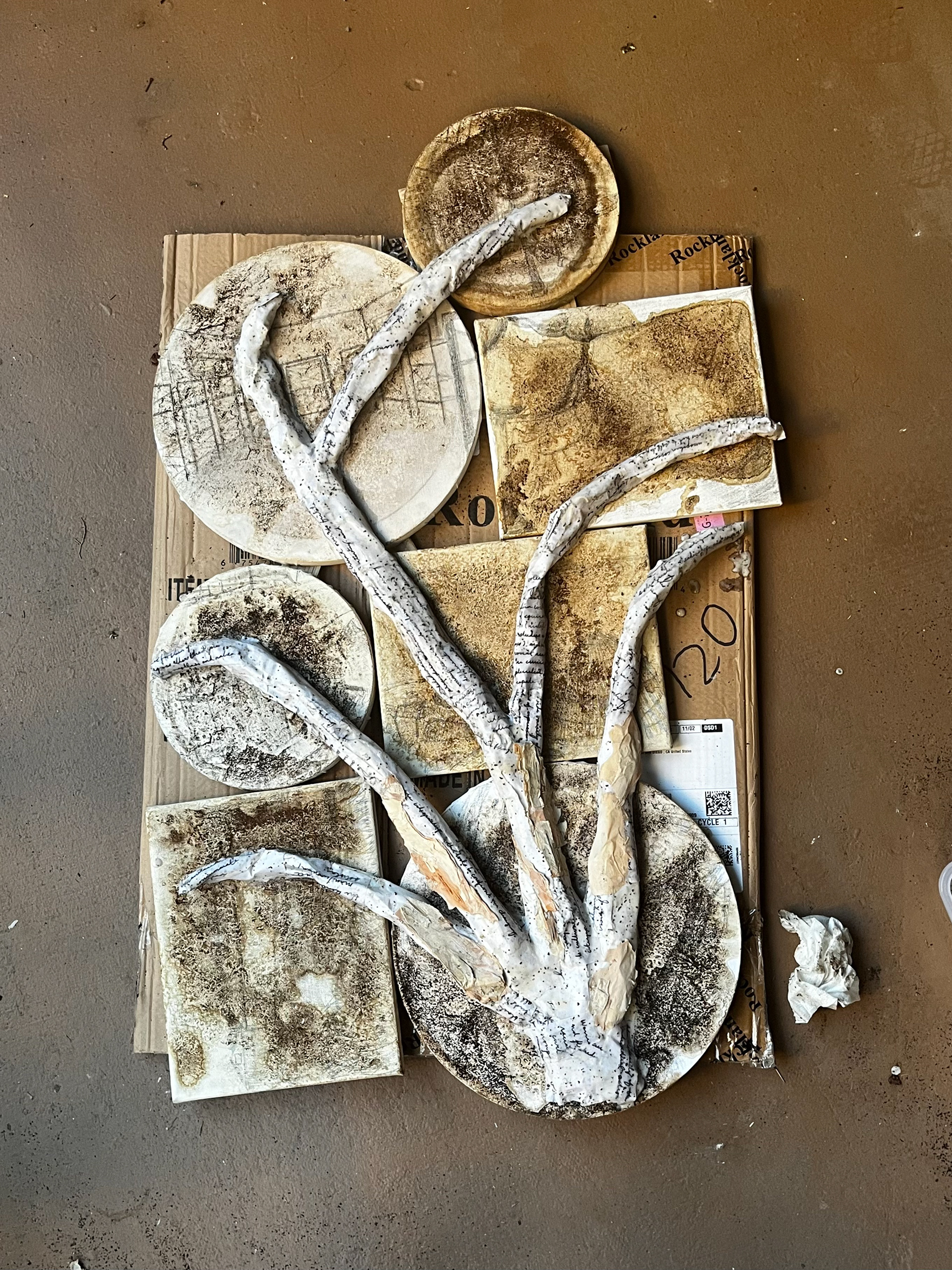 Building the paper maché tree with bark from the paper bark tree