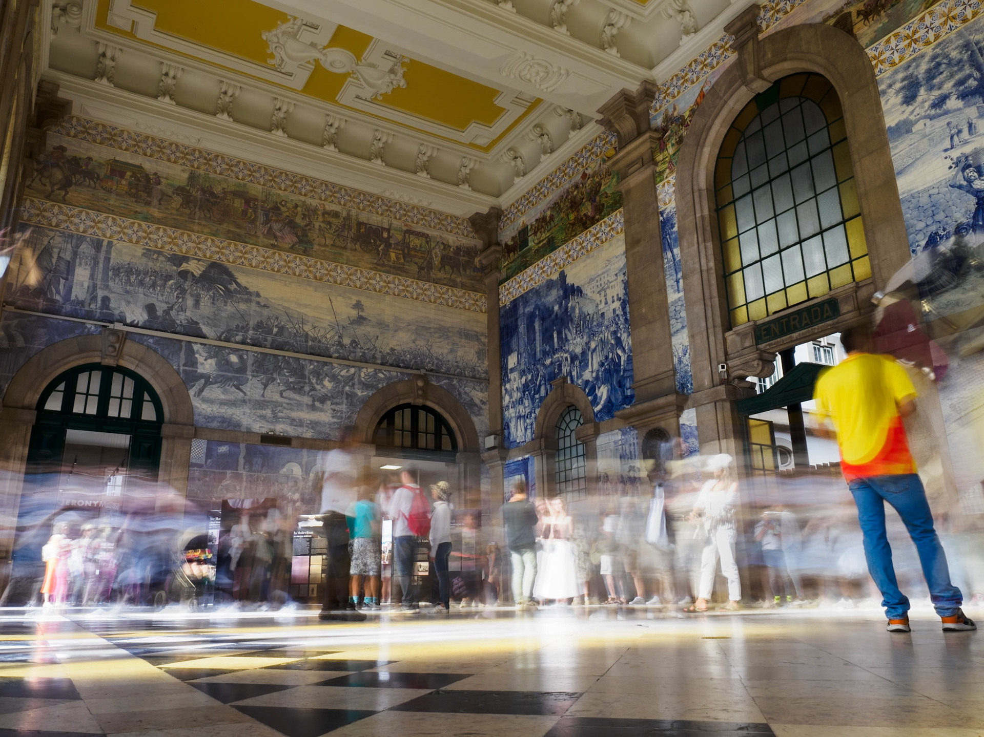 The beautiful interior of Sao Bento railway station in Porto is often busy with both local commuters as well as visitors and tourists admiring the azulejo tiled walls and impressive architecture.