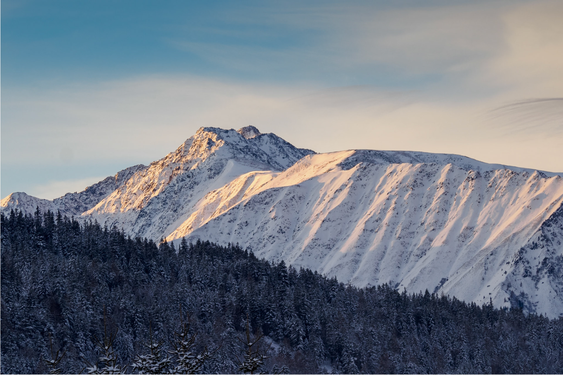 Shot at Seefeld, Austria, in December a few days before Christmas, after it snowed overnight. The golden hour light creates a stunning contrast on the snow-covered peaks